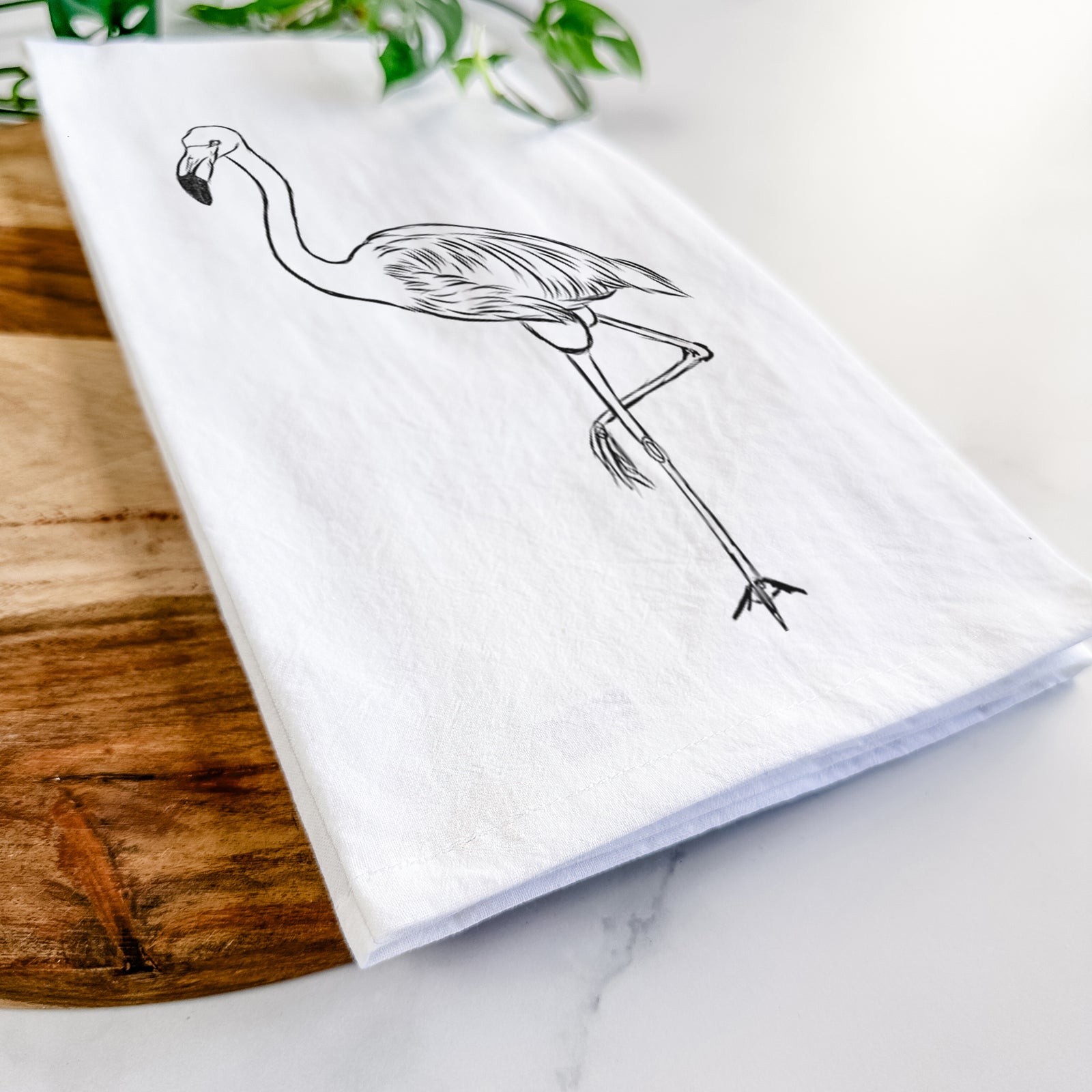 Hand-drawn sketch of Mango the Flamingo on a tea towel