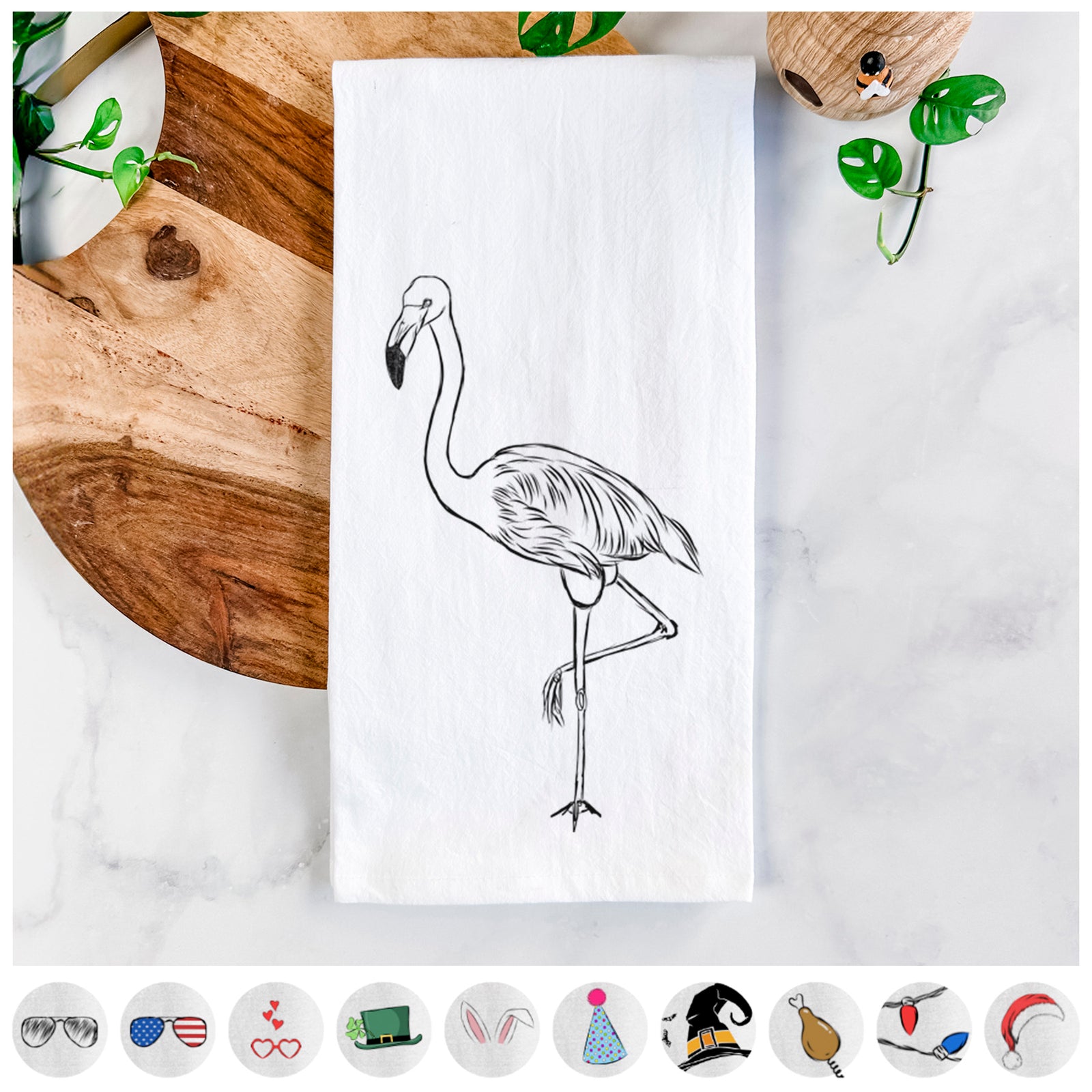 Hand-drawn sketch of Mango the Flamingo on a tea towel, shown with icons of the other available costume styles