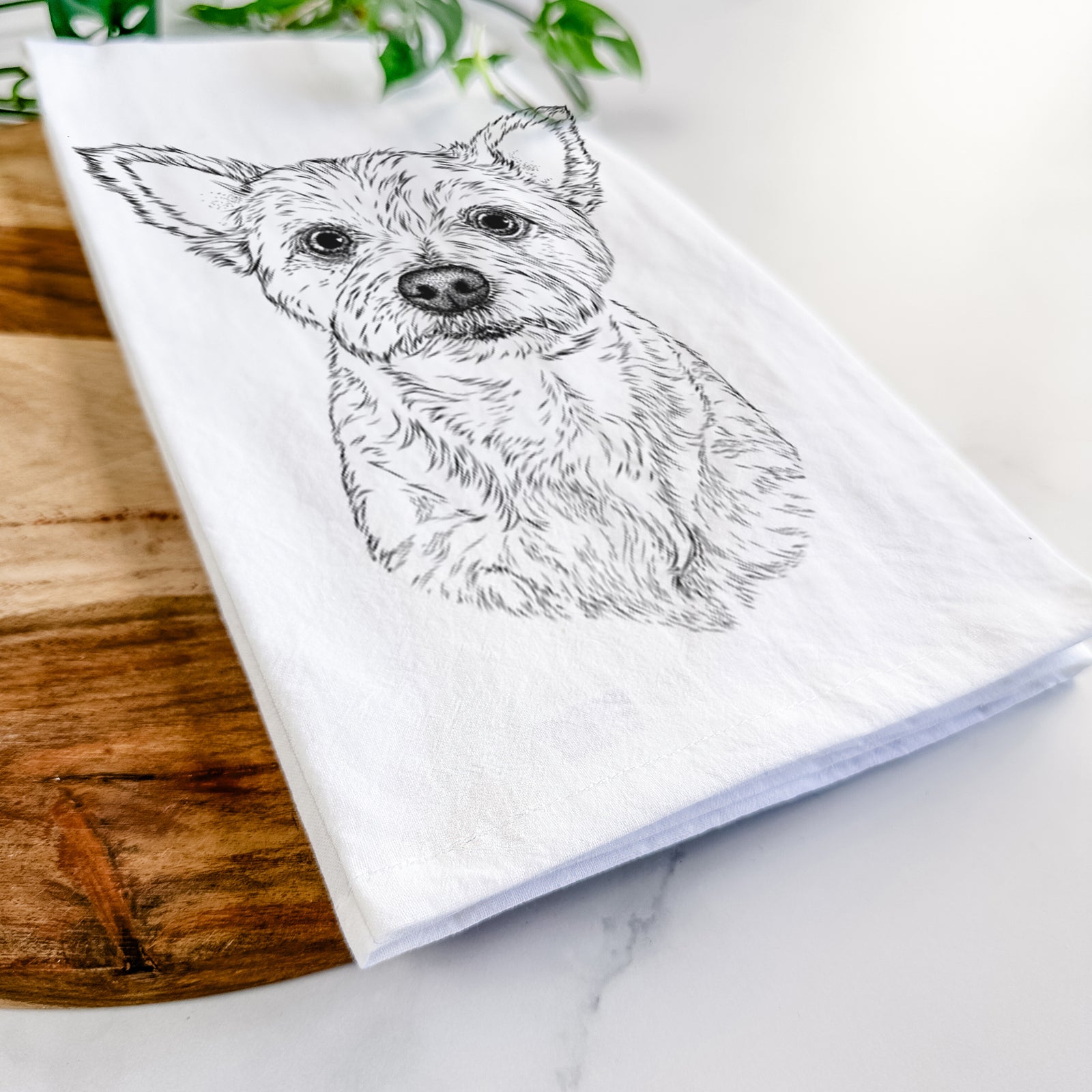 Hand-drawn sketch of Mango the Yorker Cairn Terrier Mix on a tea towel