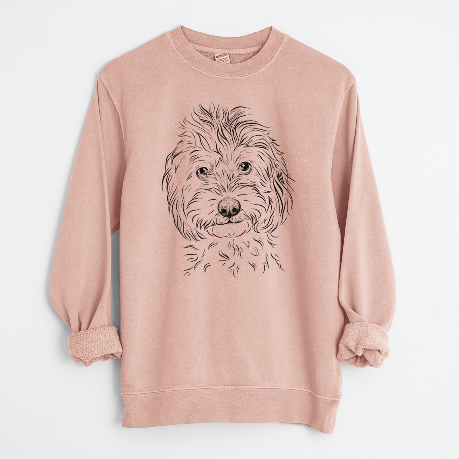 Hand-drawn sketch of Mason the Cavapoo on a Dusty Pink Unisex pigment dyed crew sweatshirt