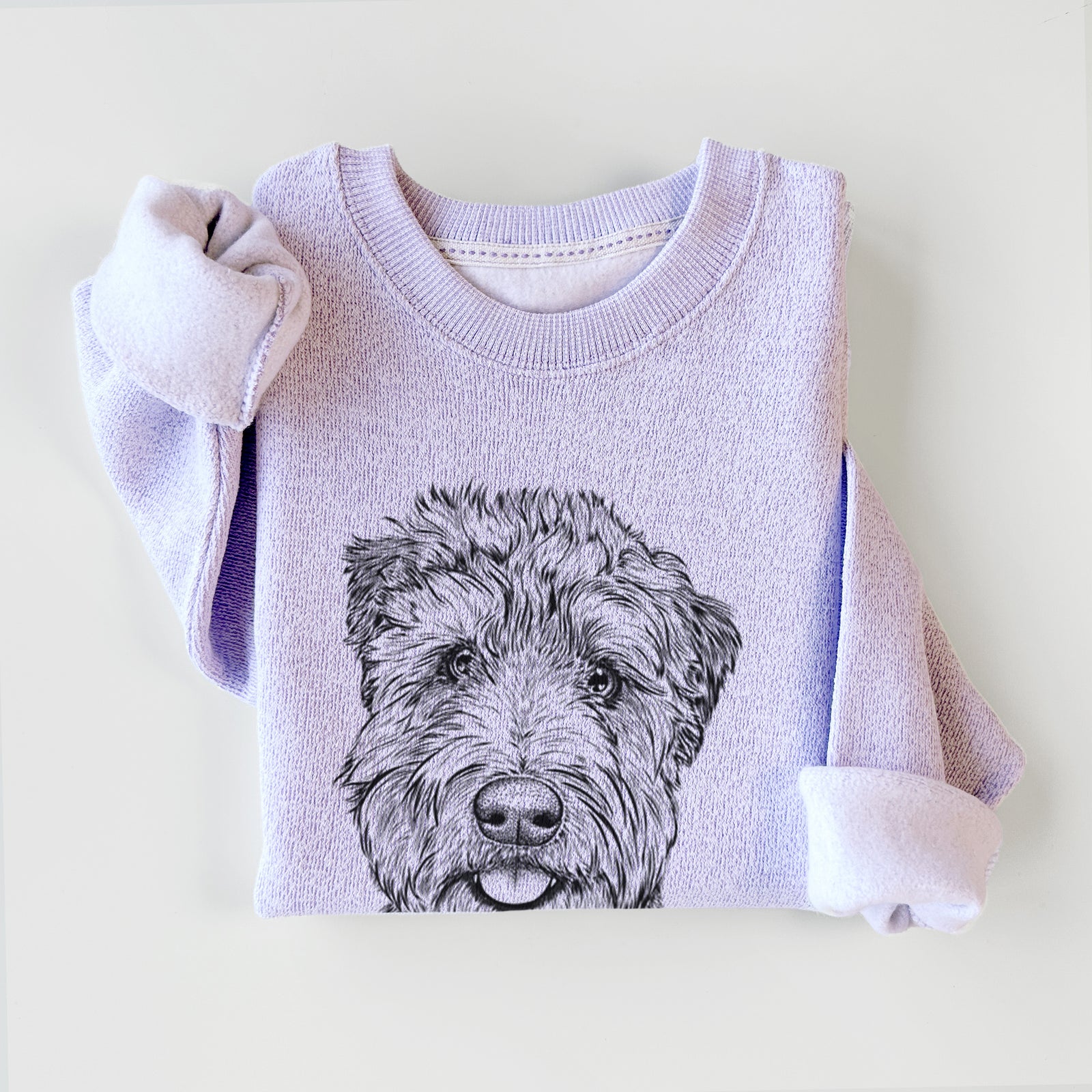 Hand-drawn sketch of Milton the Soft Coated Wheaten Terrier on an Ice Purple knit sweatshirt