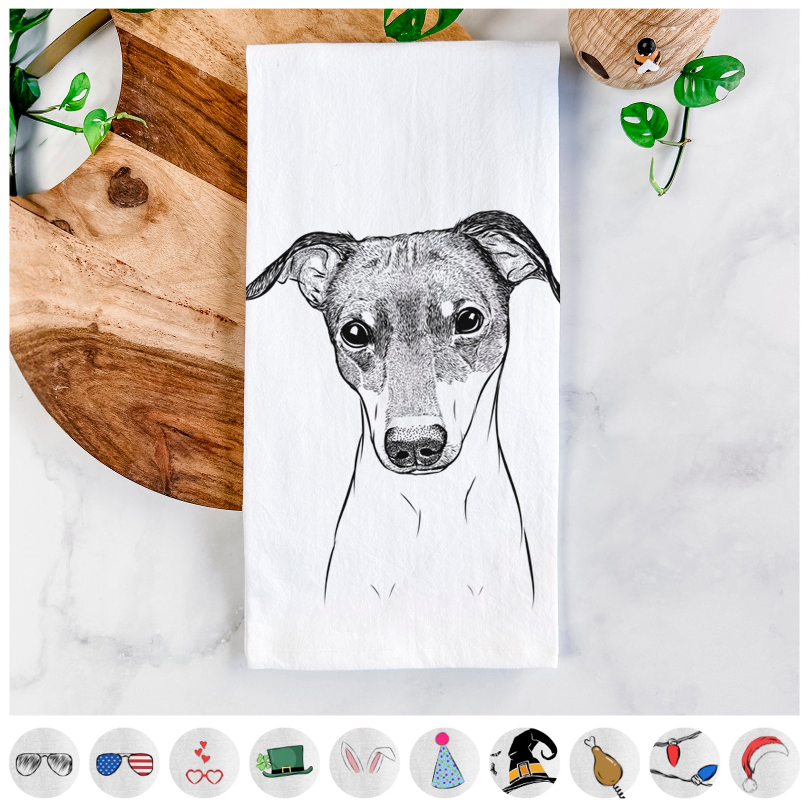 Hand-drawn sketch of Momo the Japanese Terrier on a tea towel, shown with icons of the other available costume styles