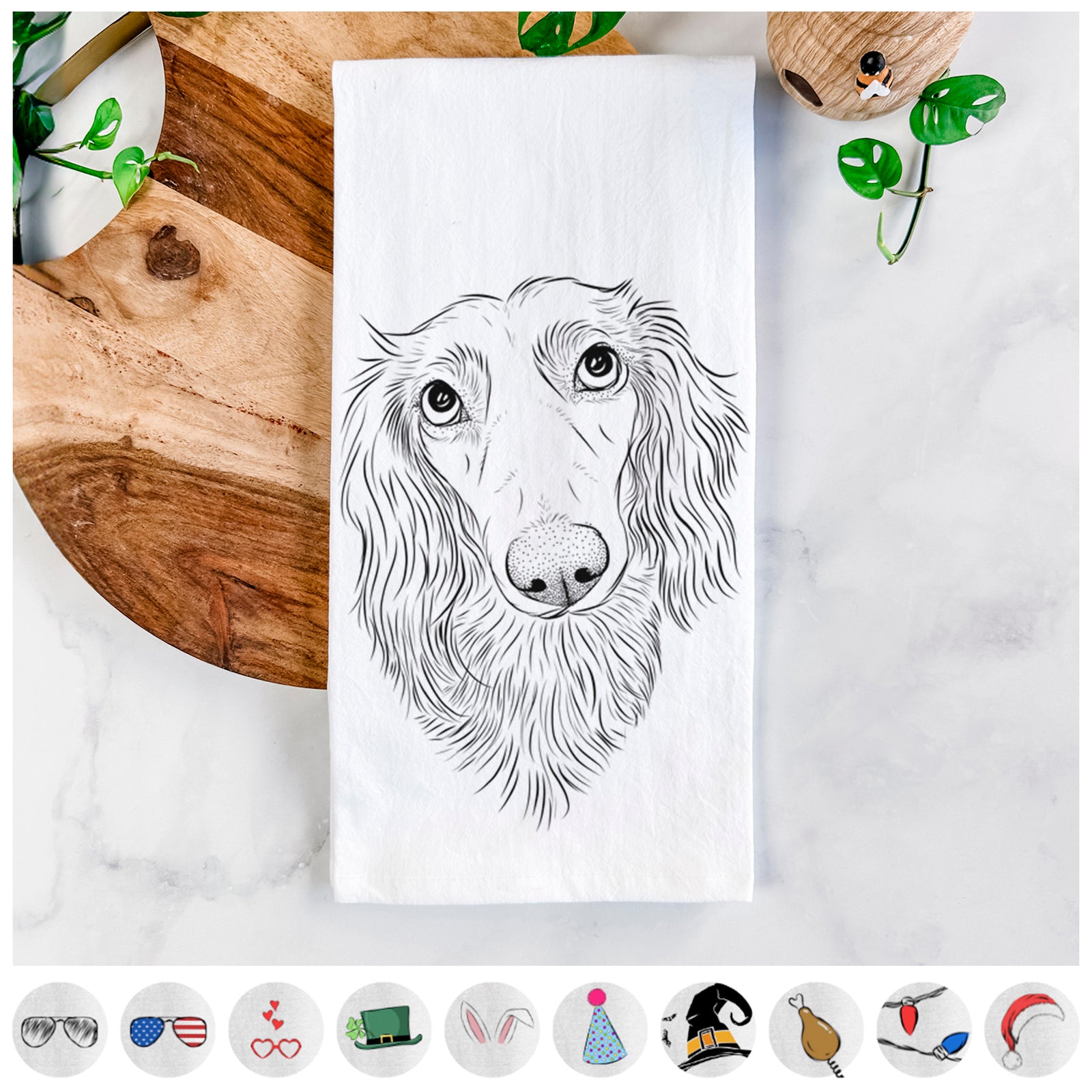 Hand-drawn sketch of Mr. Rusty the Long Haired Dachshund on a tea towel, shown with icons of the other available costume styles