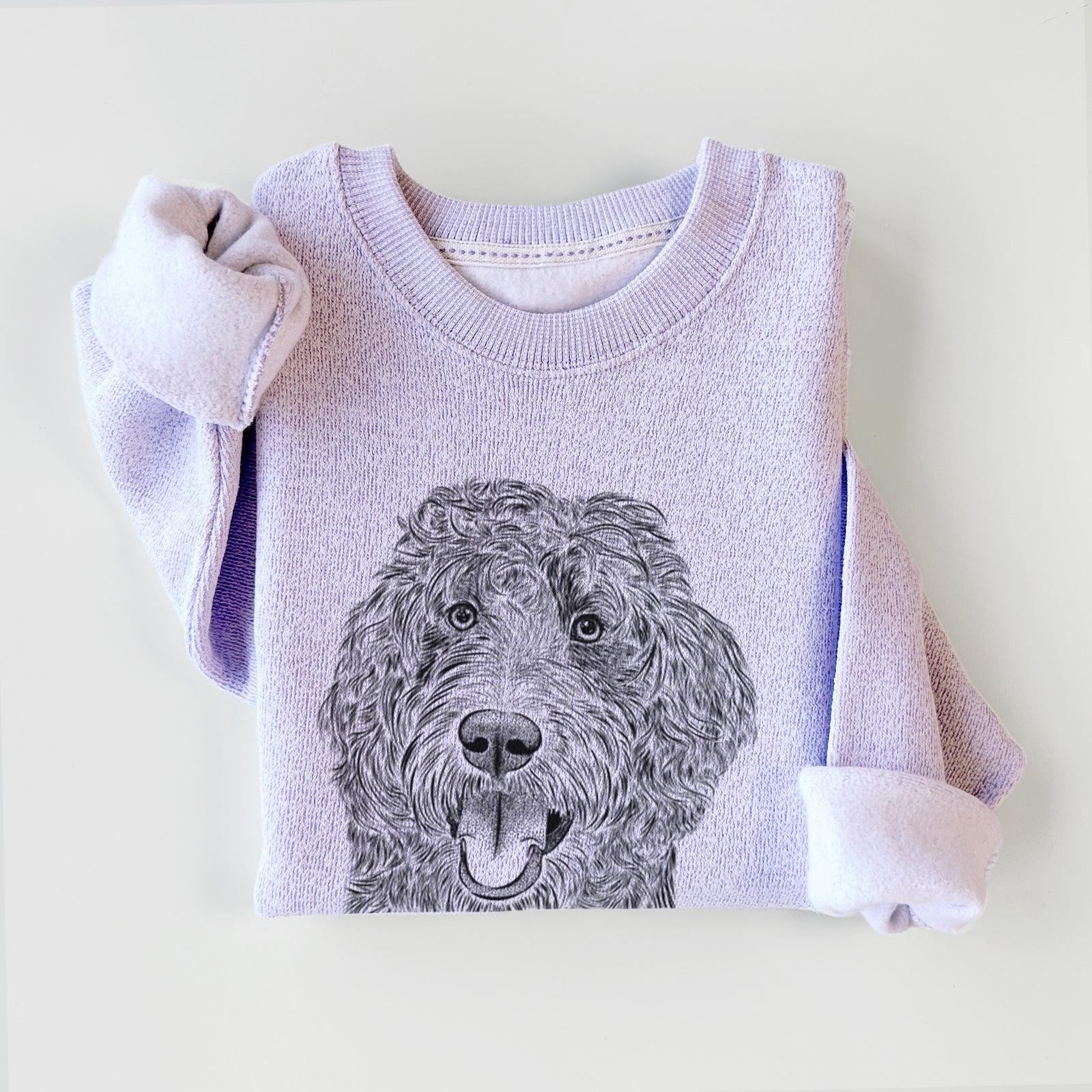 Hand-drawn sketch of Murr Dog the Labradoodle on an Ice Purple knit sweatshirt