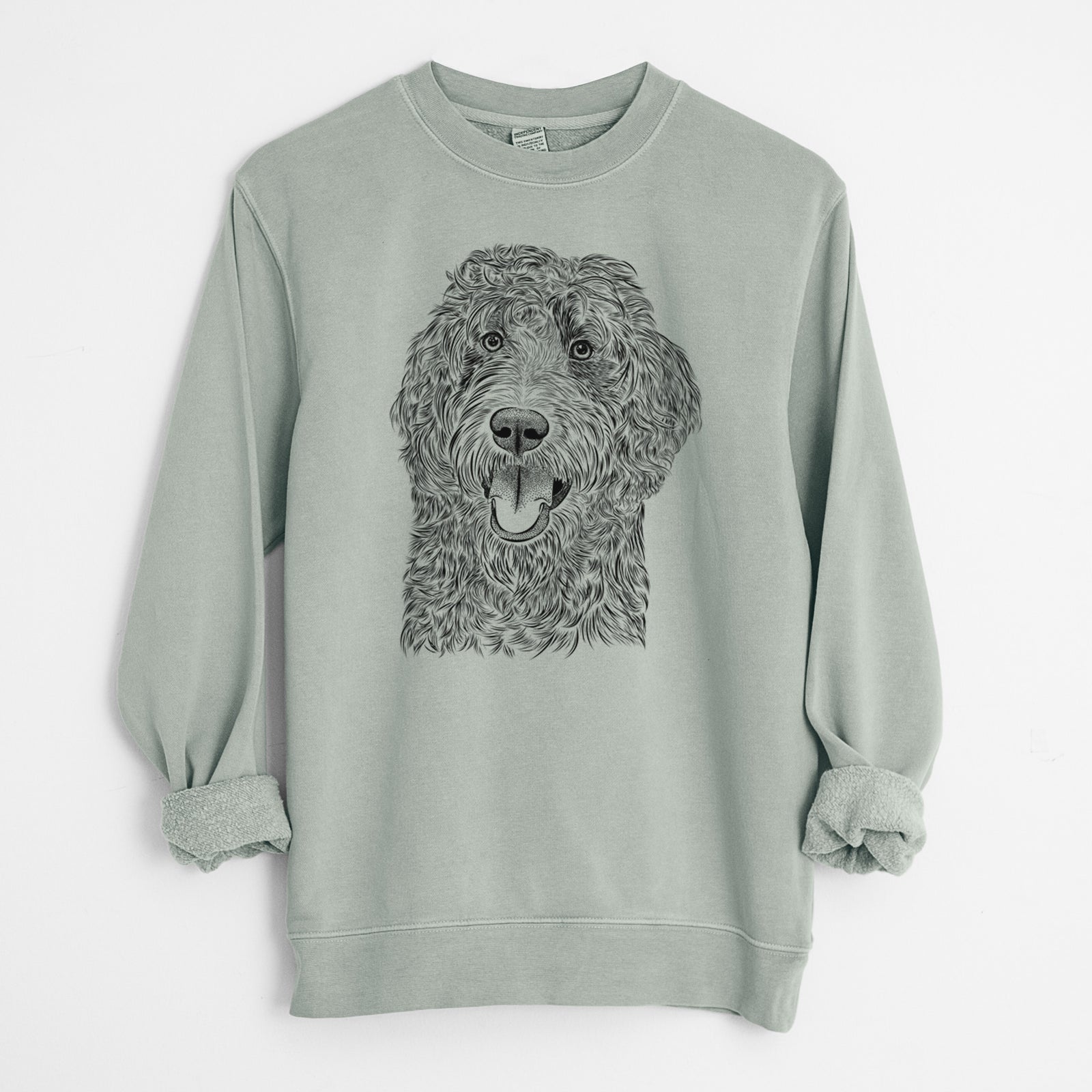Hand-drawn sketch of Murr Dog the Labradoodle on a Sage Unisex pigment dyed crew sweatshirt