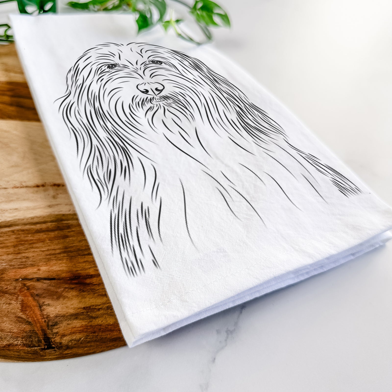 Hand-drawn sketch of Murray the Bearded Collie on a tea towel
