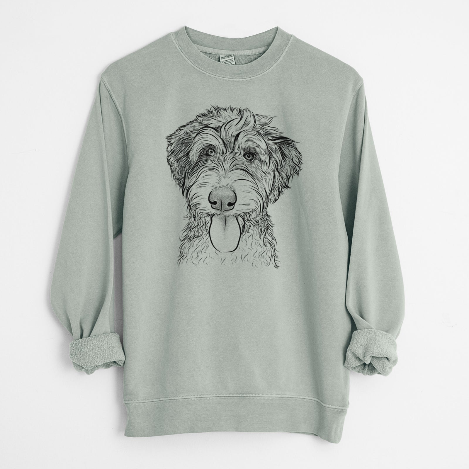 Hand-drawn sketch of Myrtle Mae the Aussiedoodle on a Sage Unisex pigment dyed crew sweatshirt