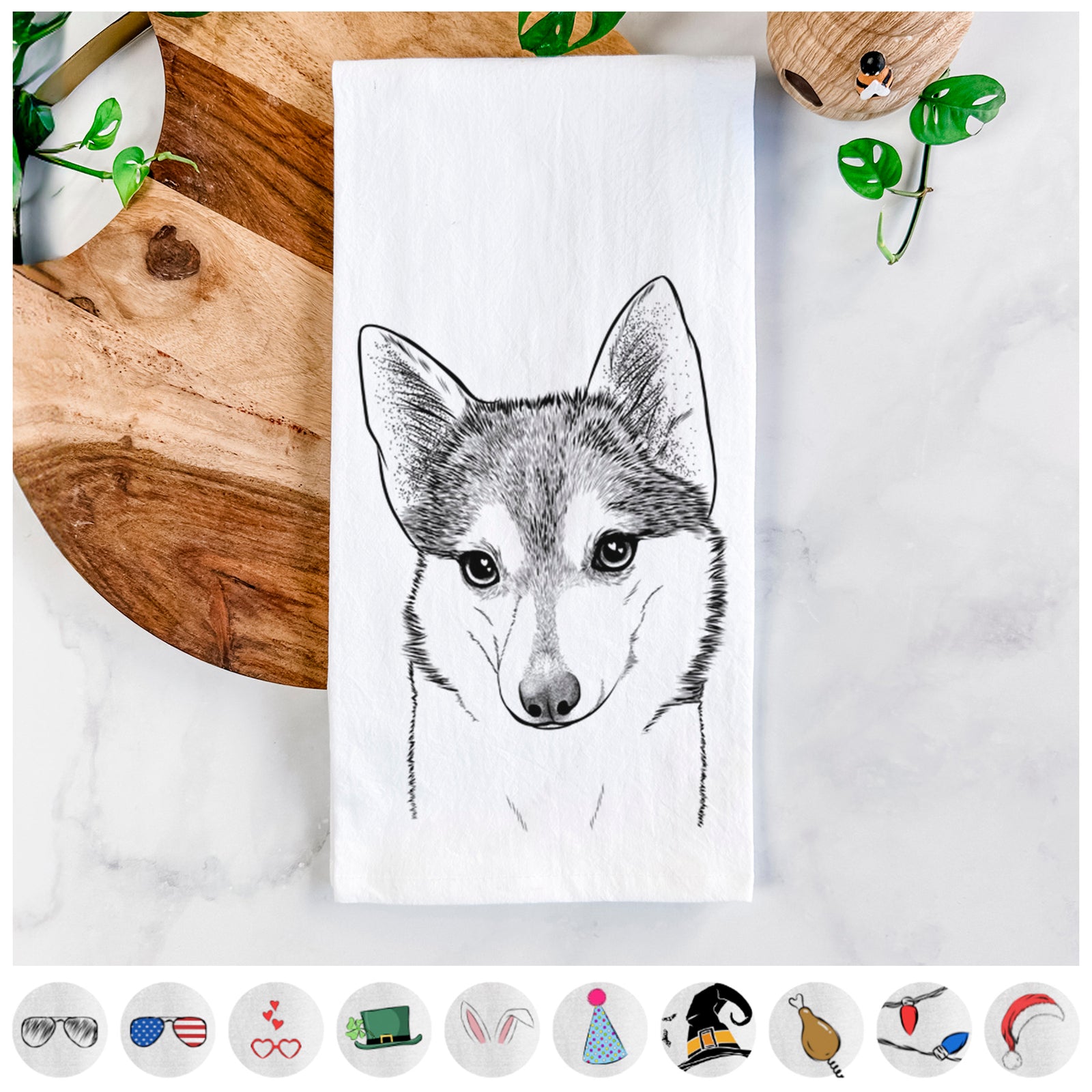 Hand-drawn sketch of Nami the Alaskan Klee Kai on a tea towel, shown with icons of the other available costume styles