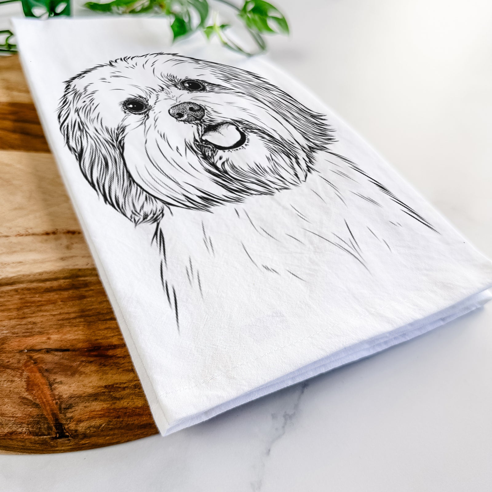 Hand-drawn sketch of Nikka the Lowchen on a tea towel