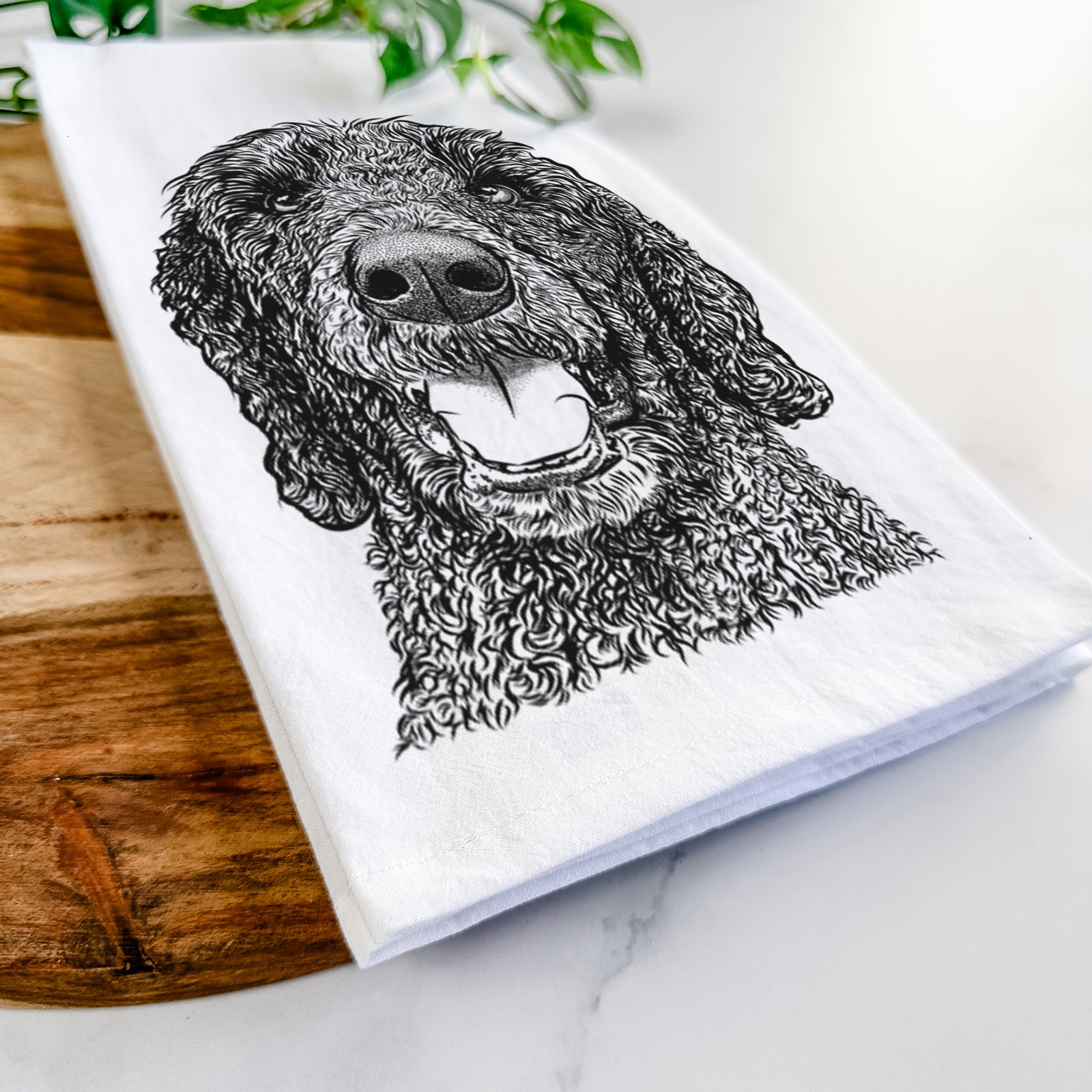 Hand-drawn sketch of Obi James the Goldendoodle on a tea towel