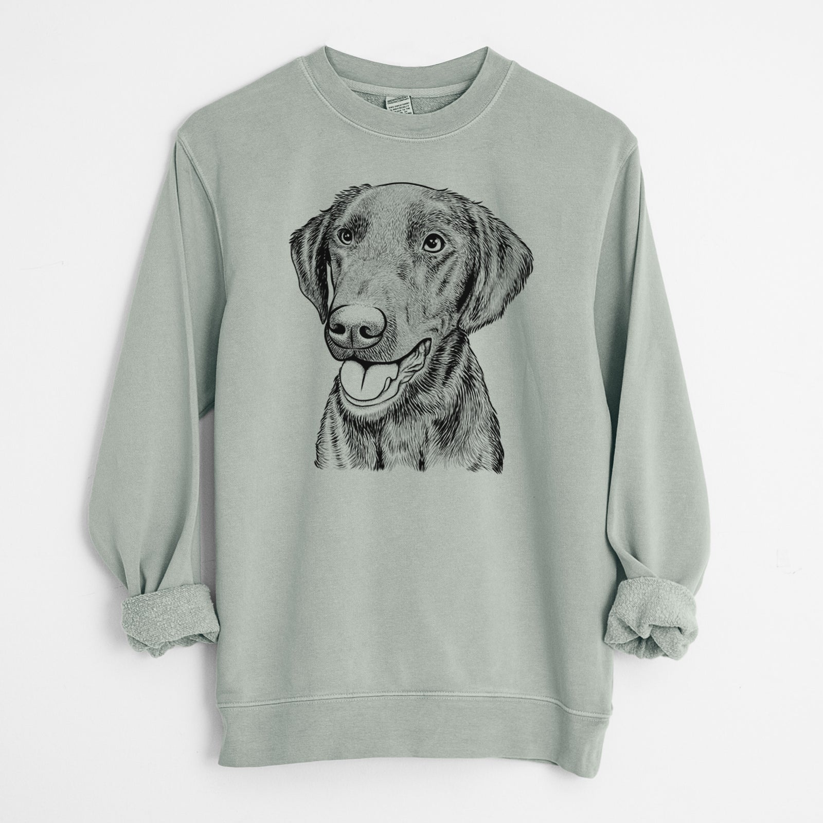 Hand-drawn sketch of Onyx the Labrador Retriever on a Sage Unisex pigment dyed crew sweatshirt
