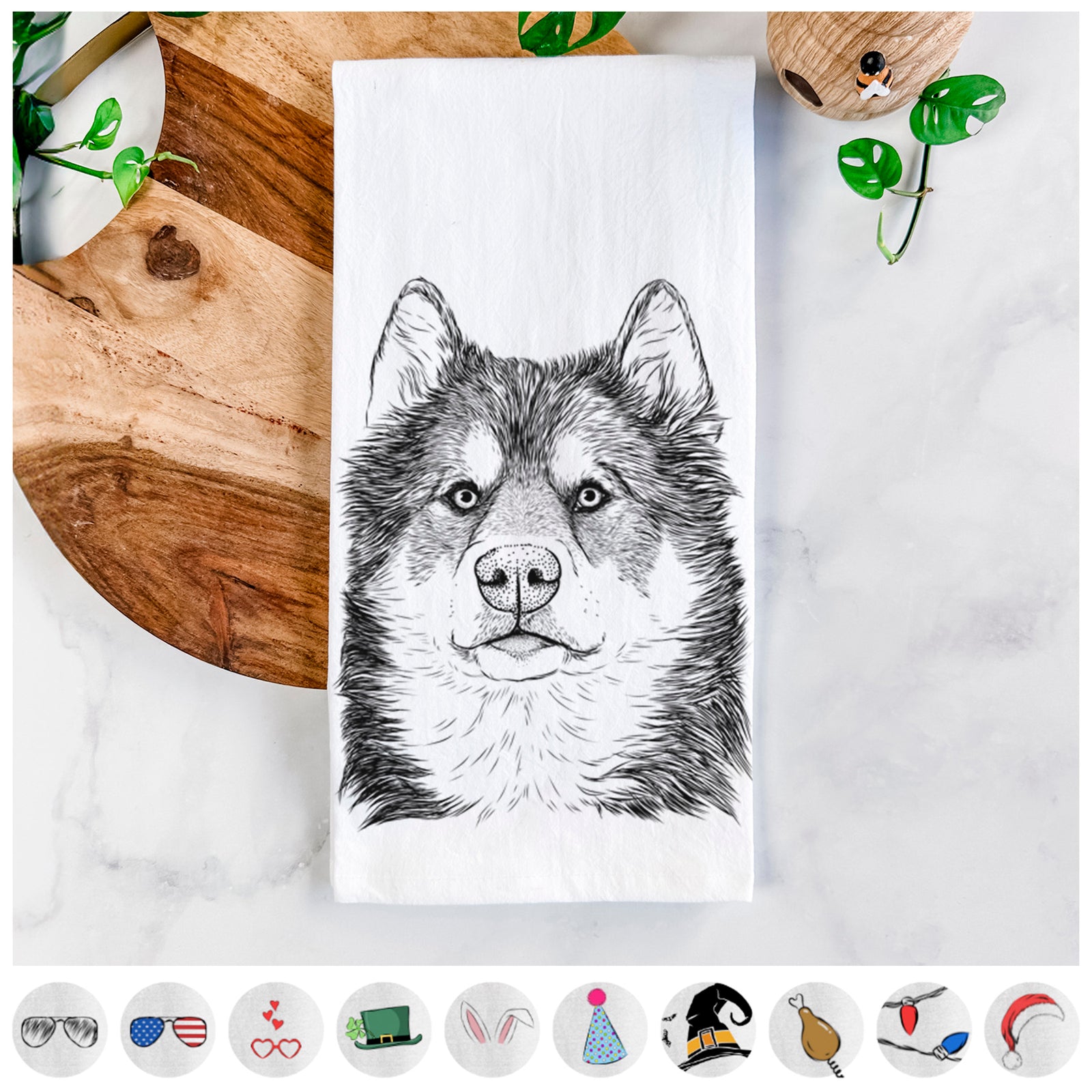 Hand-drawn sketch of Oskar the Canadian Eskimo Dog on a tea towel, shown with icons of the other available costume styles