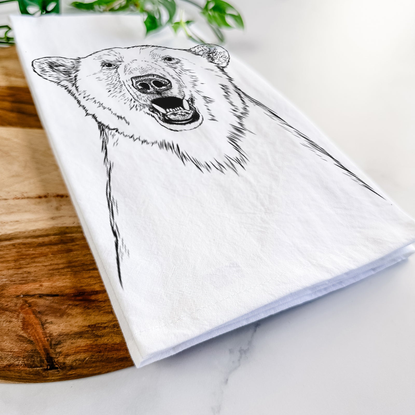 Hand-drawn sketch of Oslo the Polar Bear on a tea towel