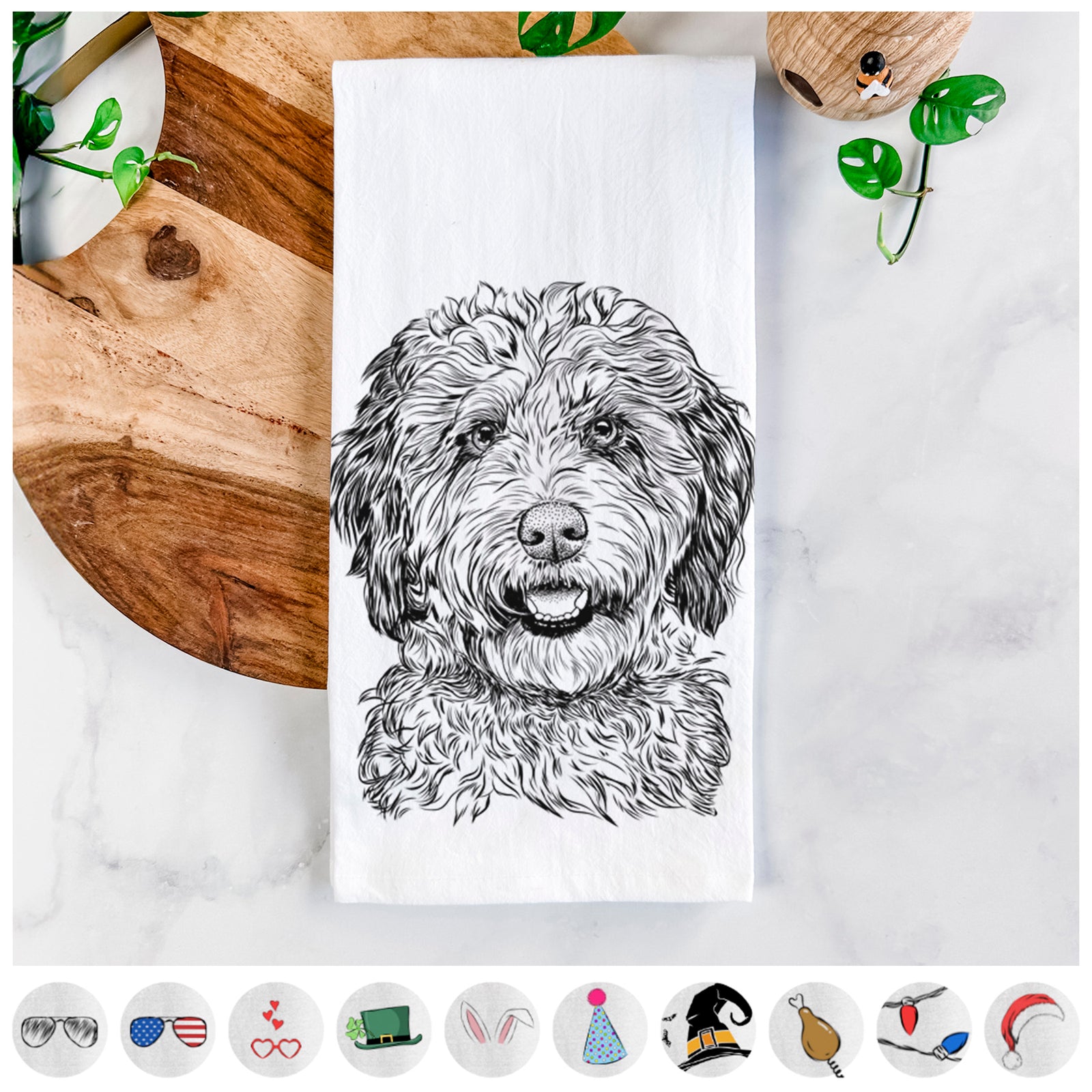 Hand-drawn sketch of Palmer the Aussiedoodle on a tea towel, shown with icons of the other available costume styles