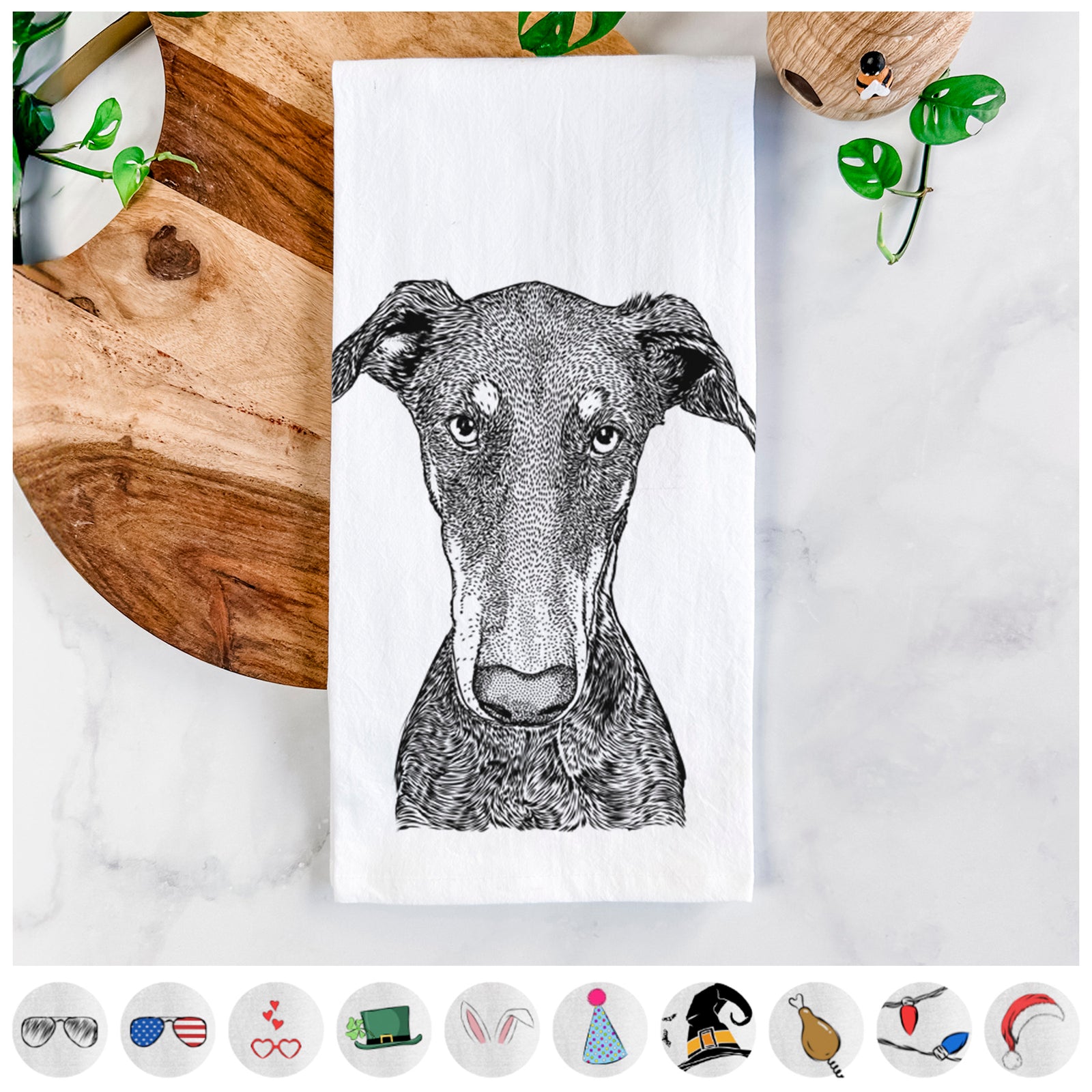 Hand-drawn sketch of Princess Fiona the Doberman Pinscher on a tea towel, shown with icons of the other available costume styles