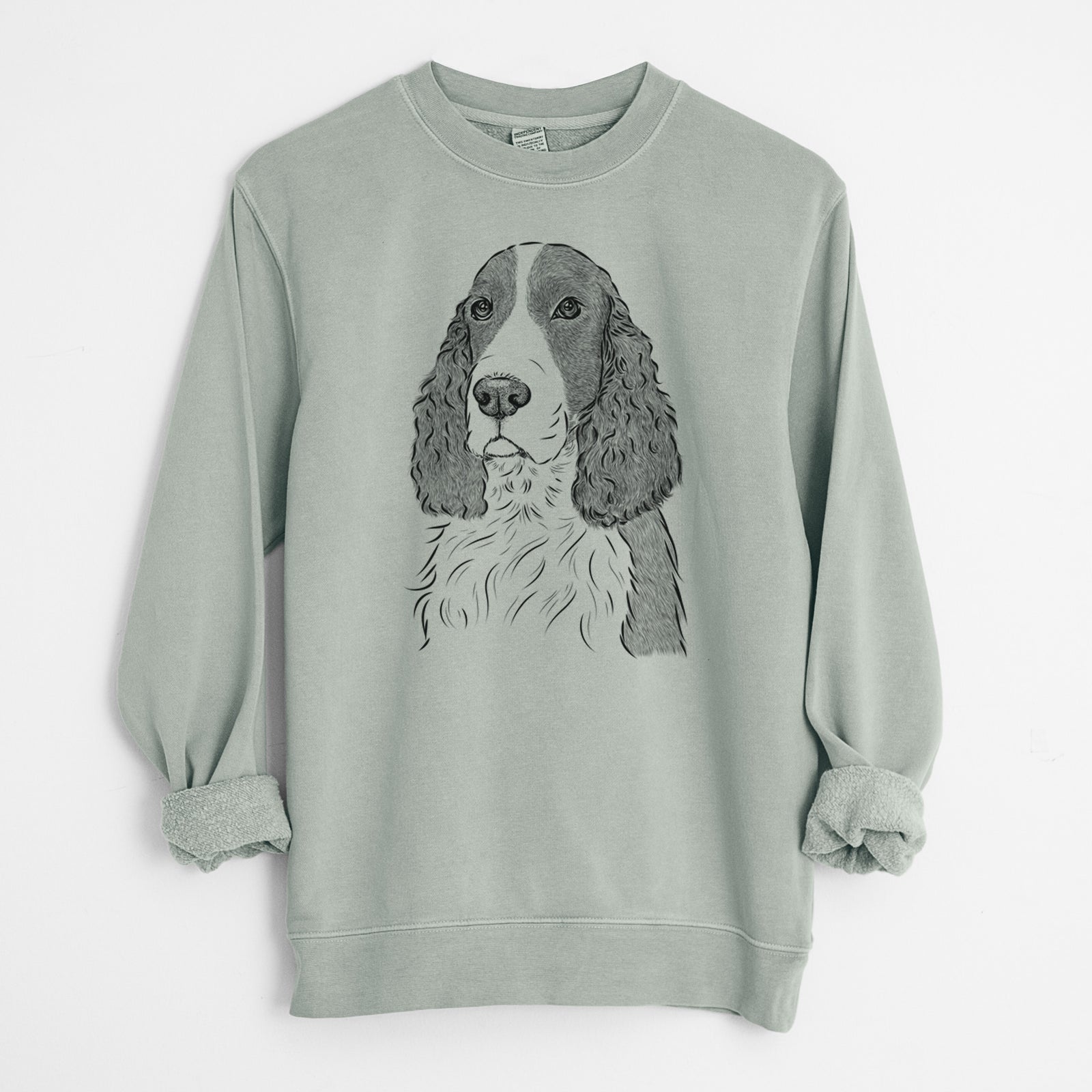 Hand-drawn sketch of Quincy the English Springer Spaniel on a Sage Unisex pigment dyed crew sweatshirt