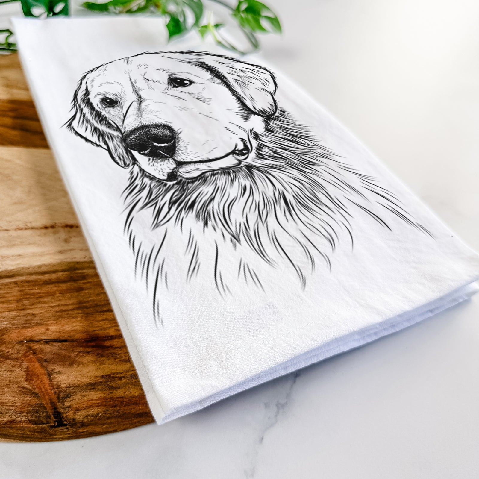 Hand-drawn sketch of Quinn the Golden Retriever on a tea towel