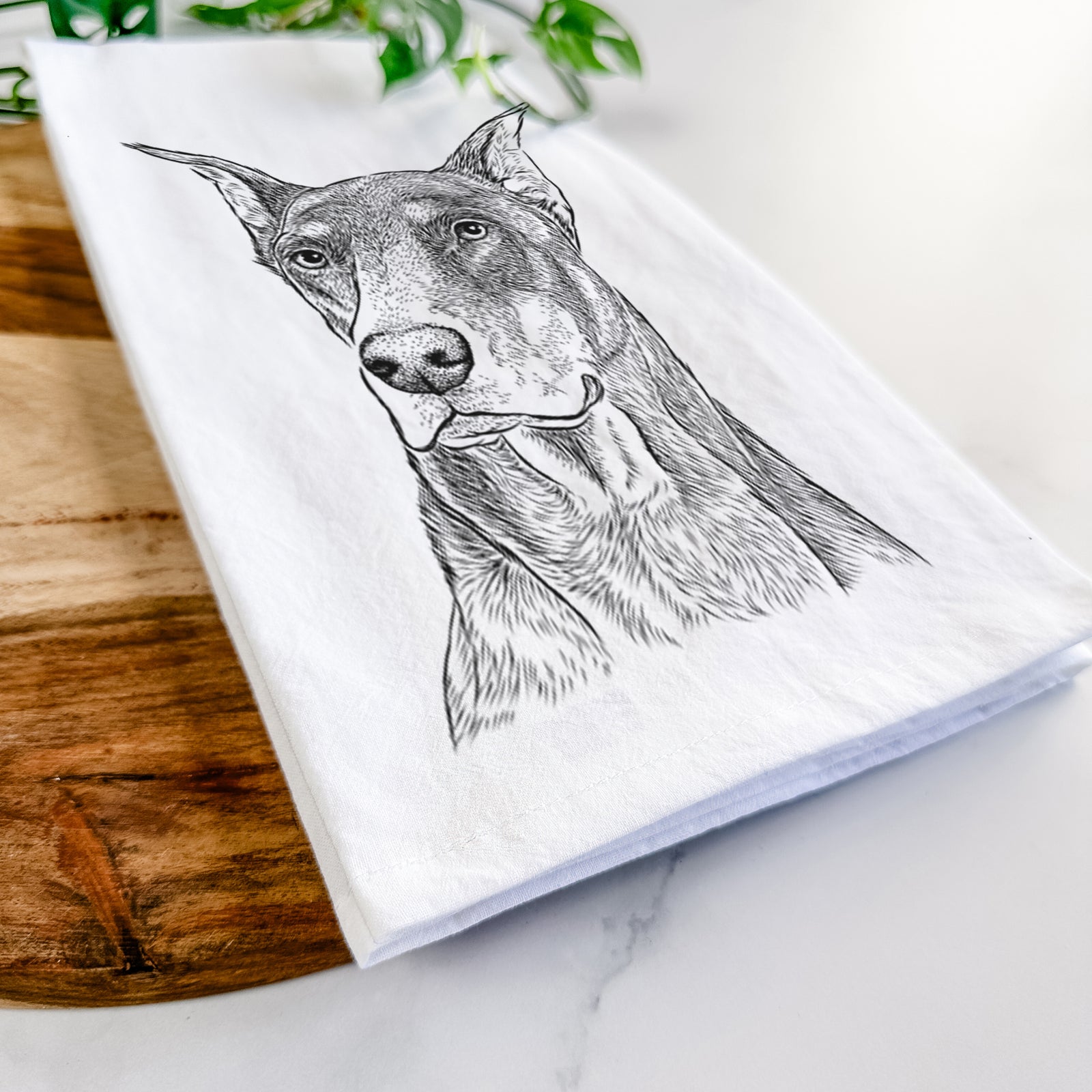 Hand-drawn sketch of RJ the Doberman Pinscher on a tea towel