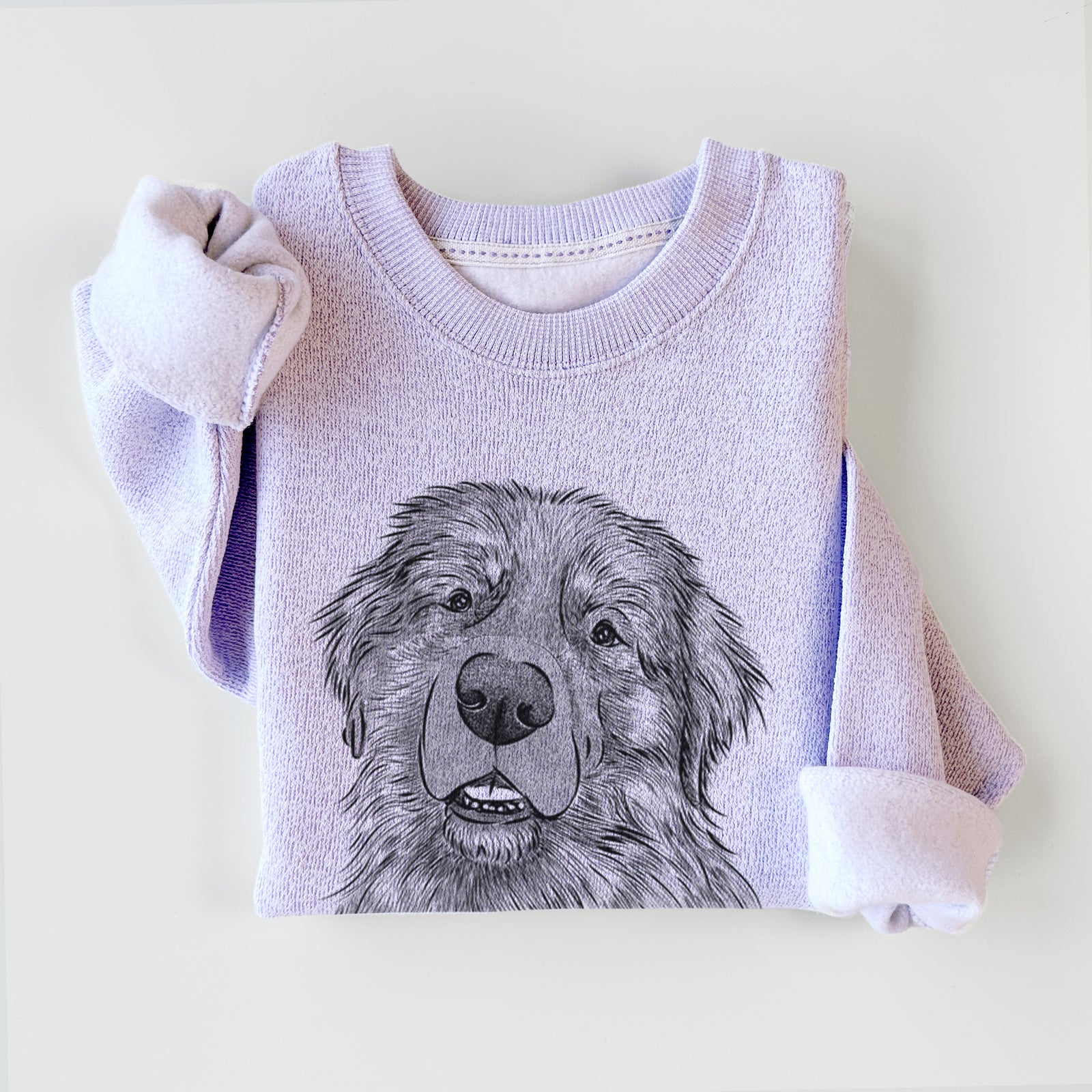 Hand-drawn sketch of Ralph the Leonberger on an Ice Purple knit sweatshirt