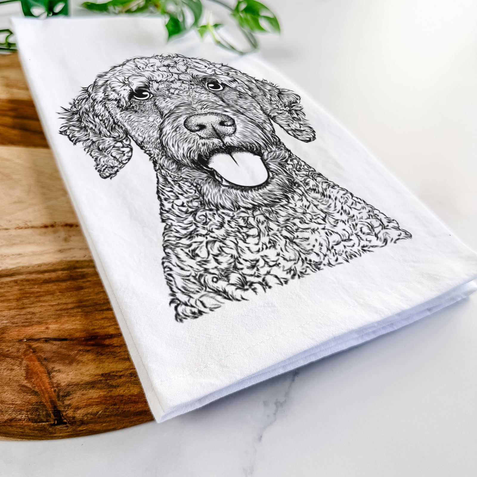 Hand-drawn sketch of Reina the Spanish Water Dog on a tea towel