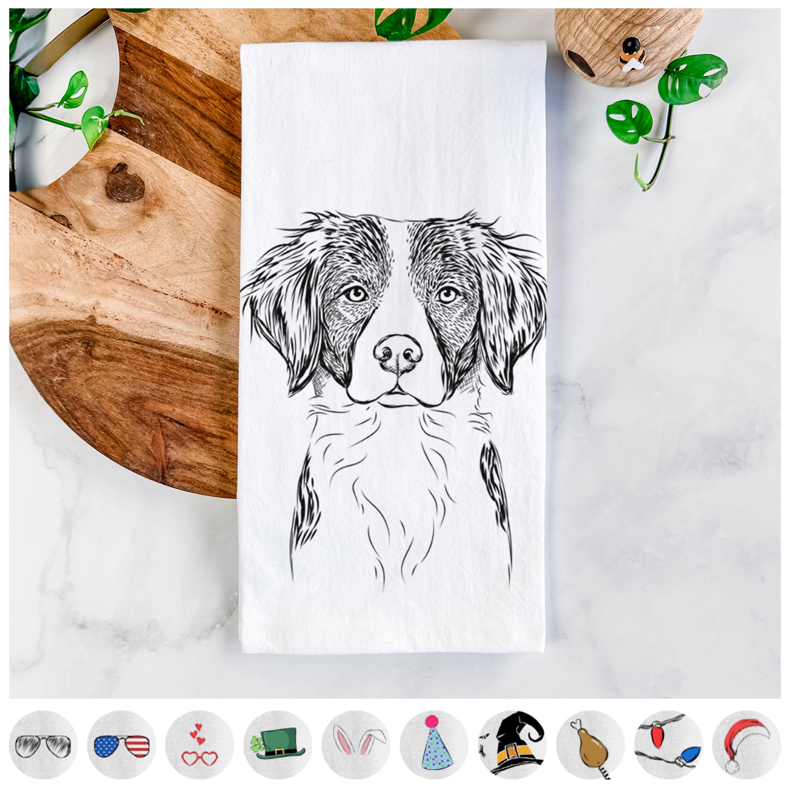 Hand-drawn sketch of Remi the Brittany on a tea towel, shown with icons of the other available costume styles