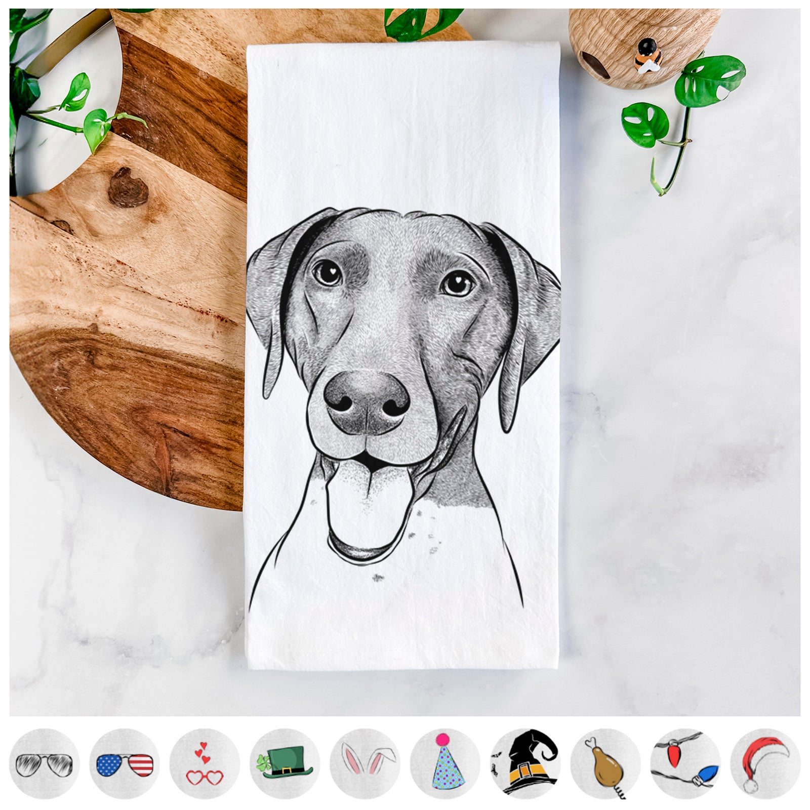 Hand-drawn sketch of Remi the German Shorthaired Pointer on a tea towel, shown with icons of the other available costume styles