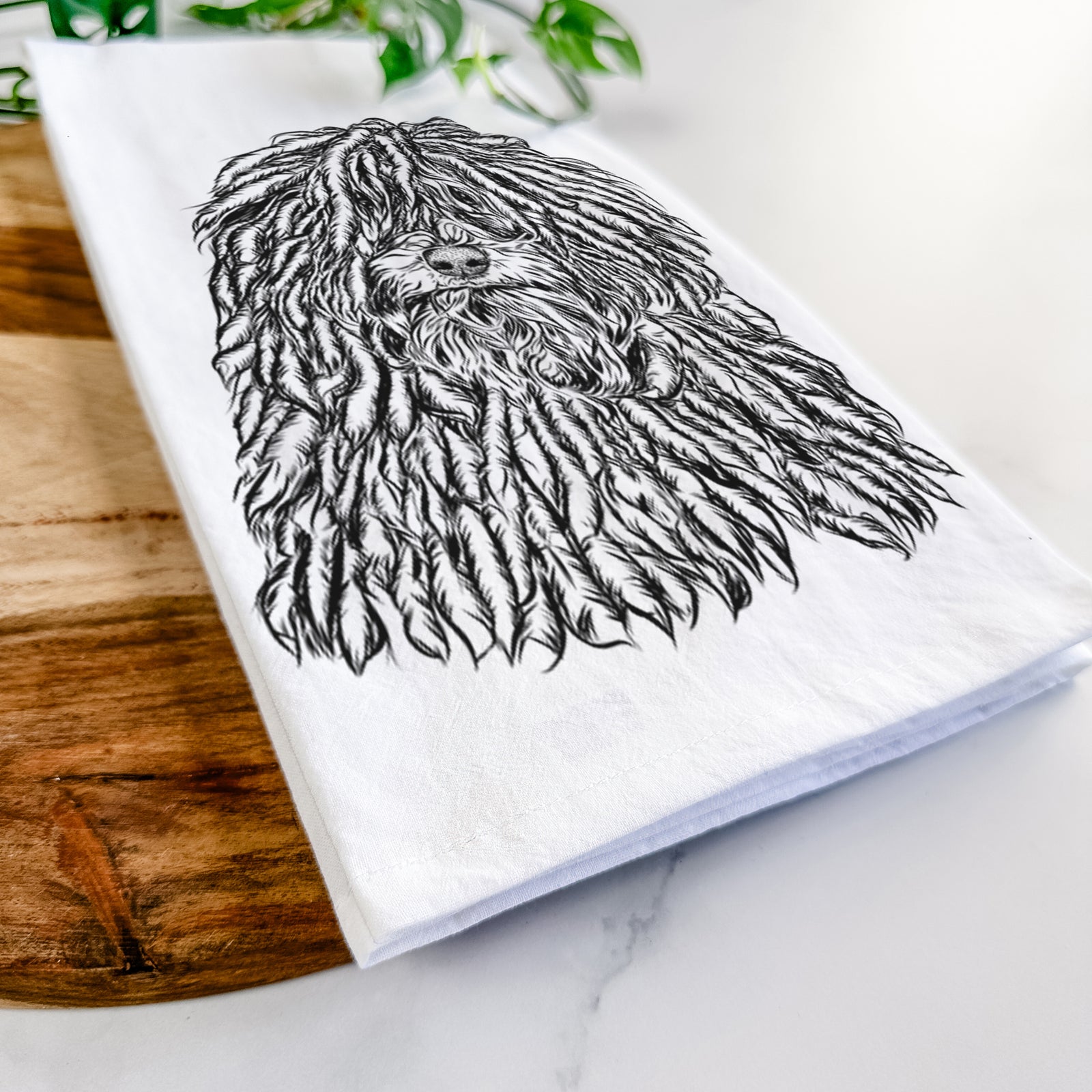 Hand-drawn sketch of Rezi the Puli on a tea towel