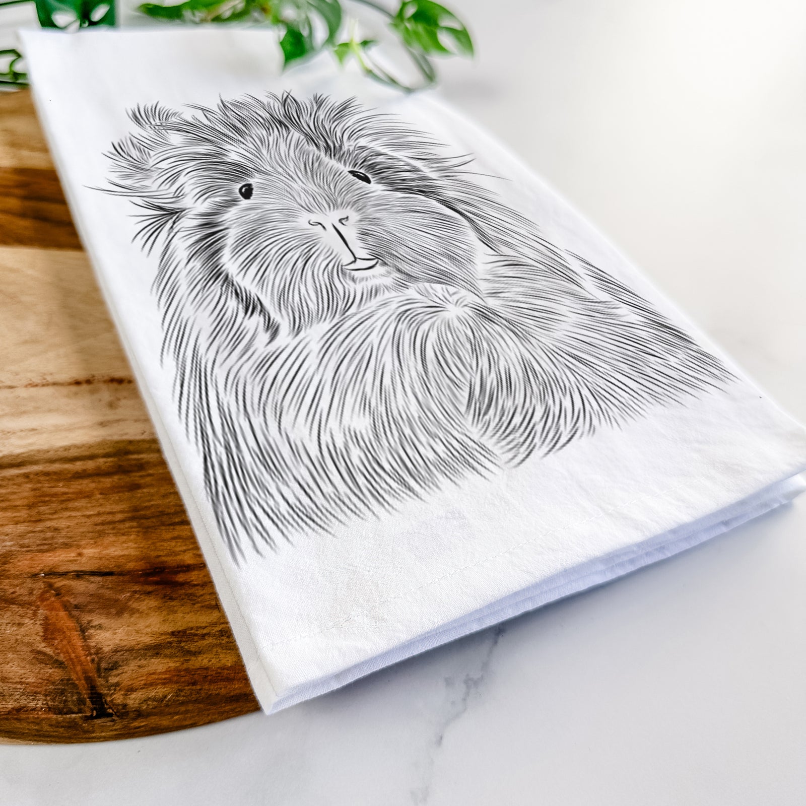 Hand-drawn sketch of Rhino the Guinea Pig on a tea towel