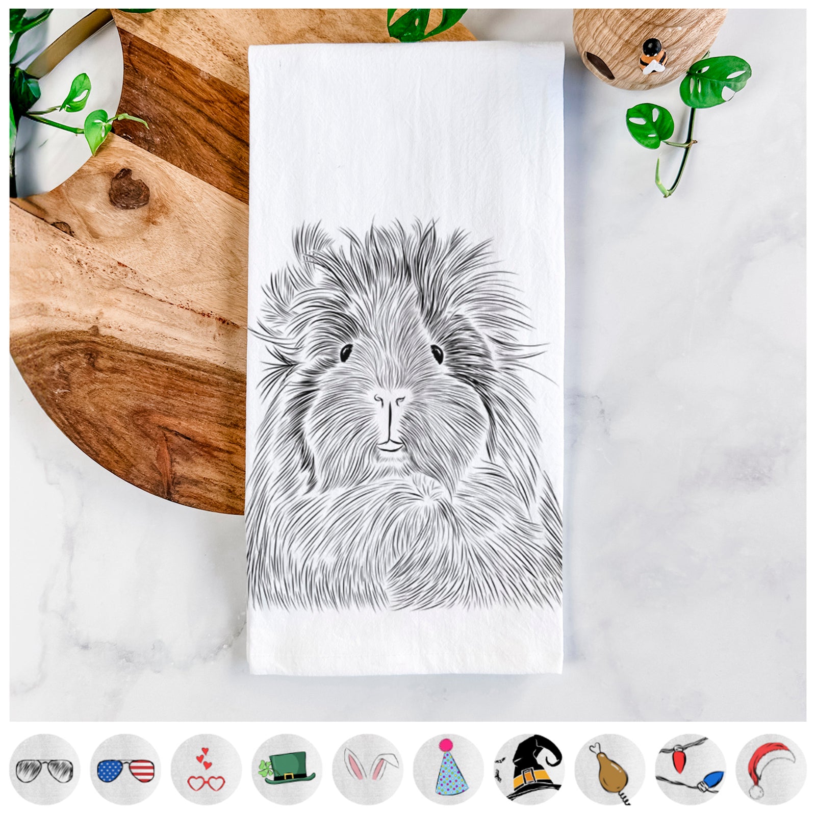 Hand-drawn sketch of Rhino the Guinea Pig on a tea towel, shown with icons of the other available costume styles