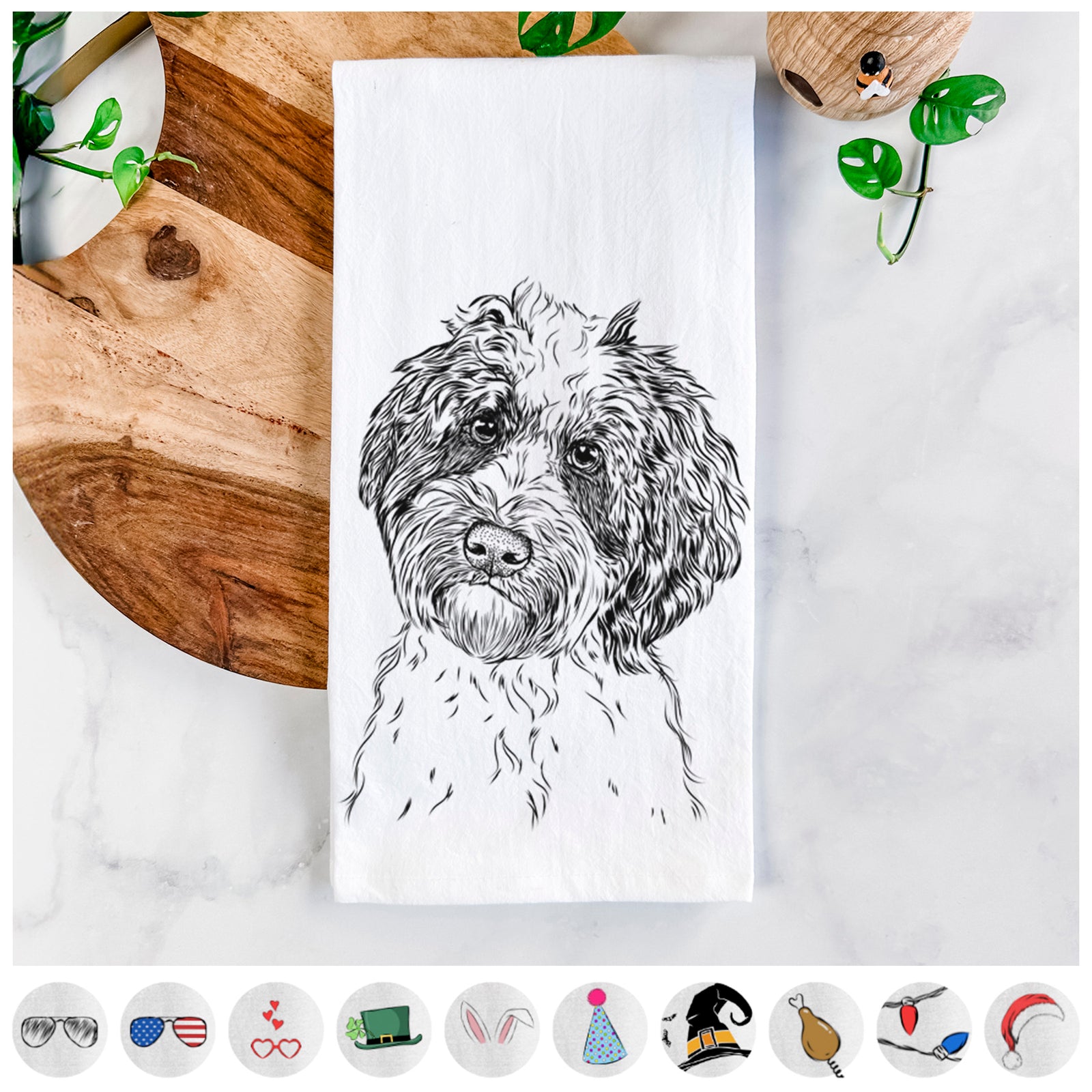 Hand-drawn sketch of Rooney the Aussiedoodle on a tea towel, shown with icons of the other available costume styles