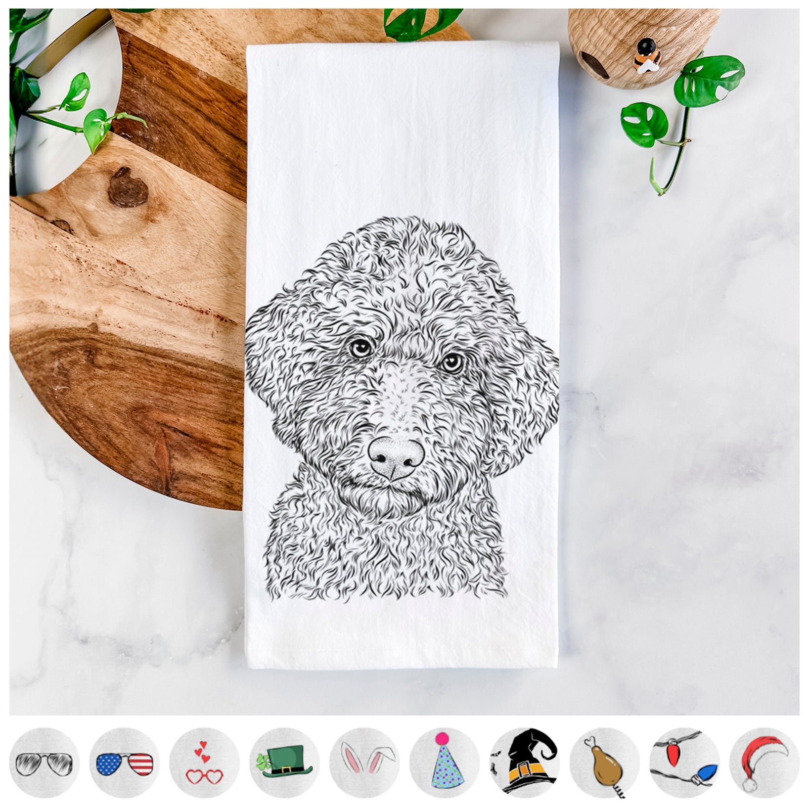 Hand-drawn sketch of Ross the Lagotto Romagnolo on a tea towel, shown with icons of the other available costume styles
