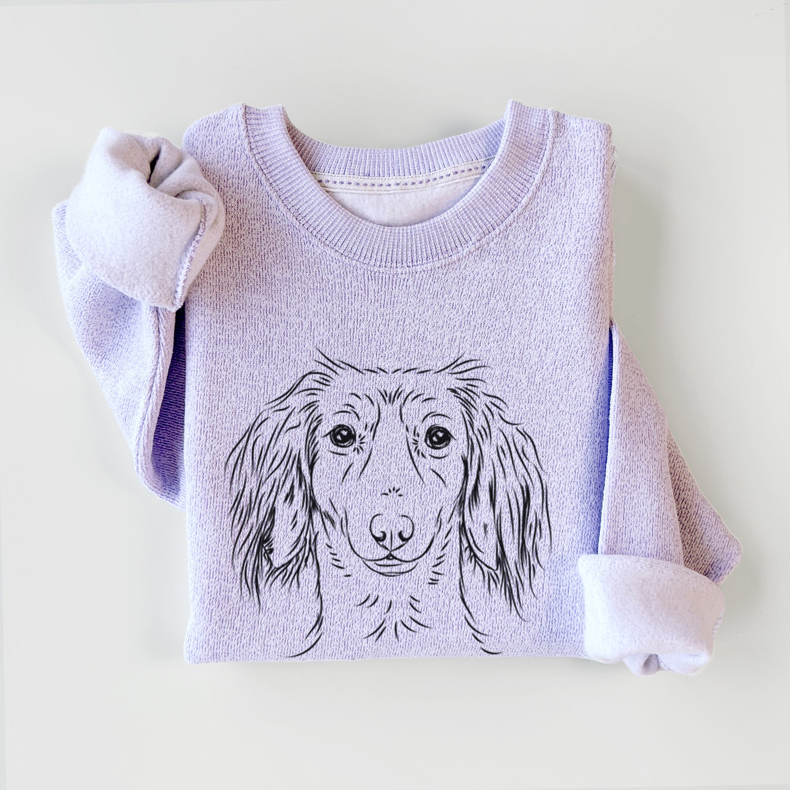Hand-drawn sketch of Roux the Long Haired Dachshund on an Ice Purple knit sweatshirt