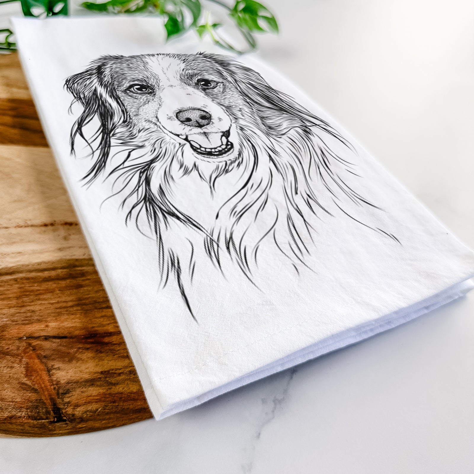 Hand-drawn sketch of Rutger the Nederlandse Kooikerhondje on a tea towel
