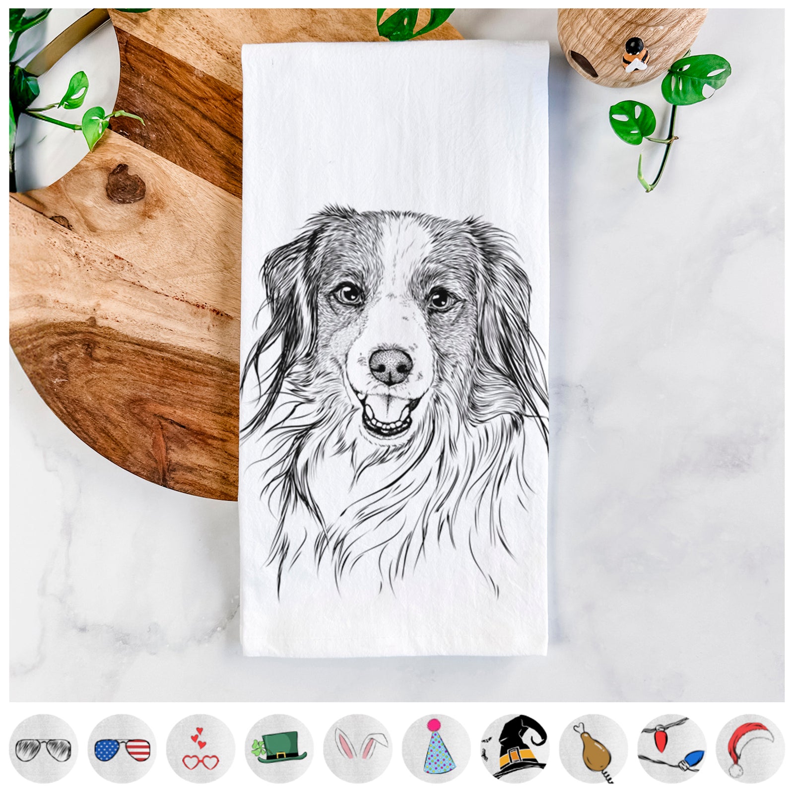 Hand-drawn sketch of Rutger the Nederlandse Kooikerhondje on a tea towel, shown with icons of the other available costume styles