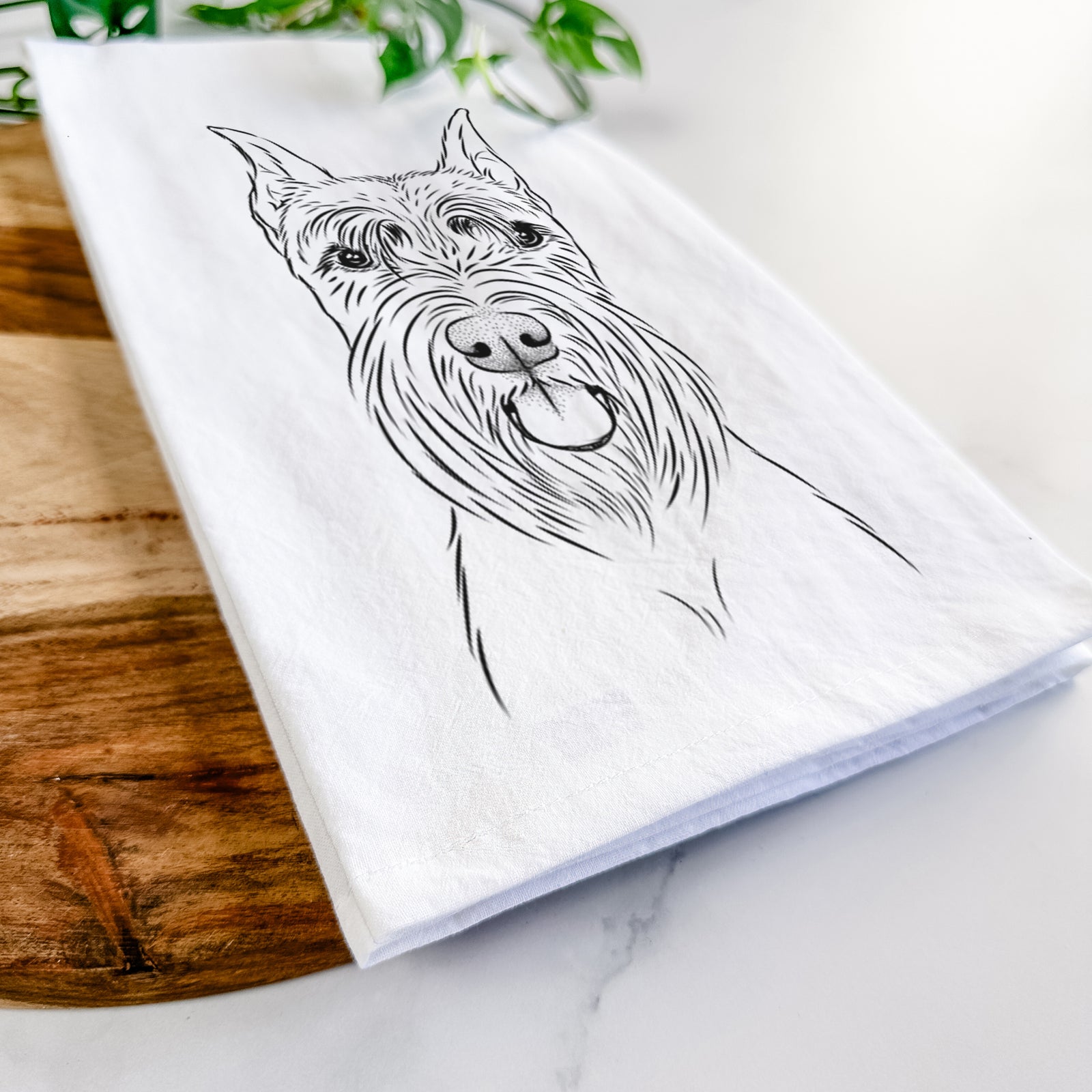 Hand-drawn sketch of Samuel the Standard Schnauzer on a tea towel
