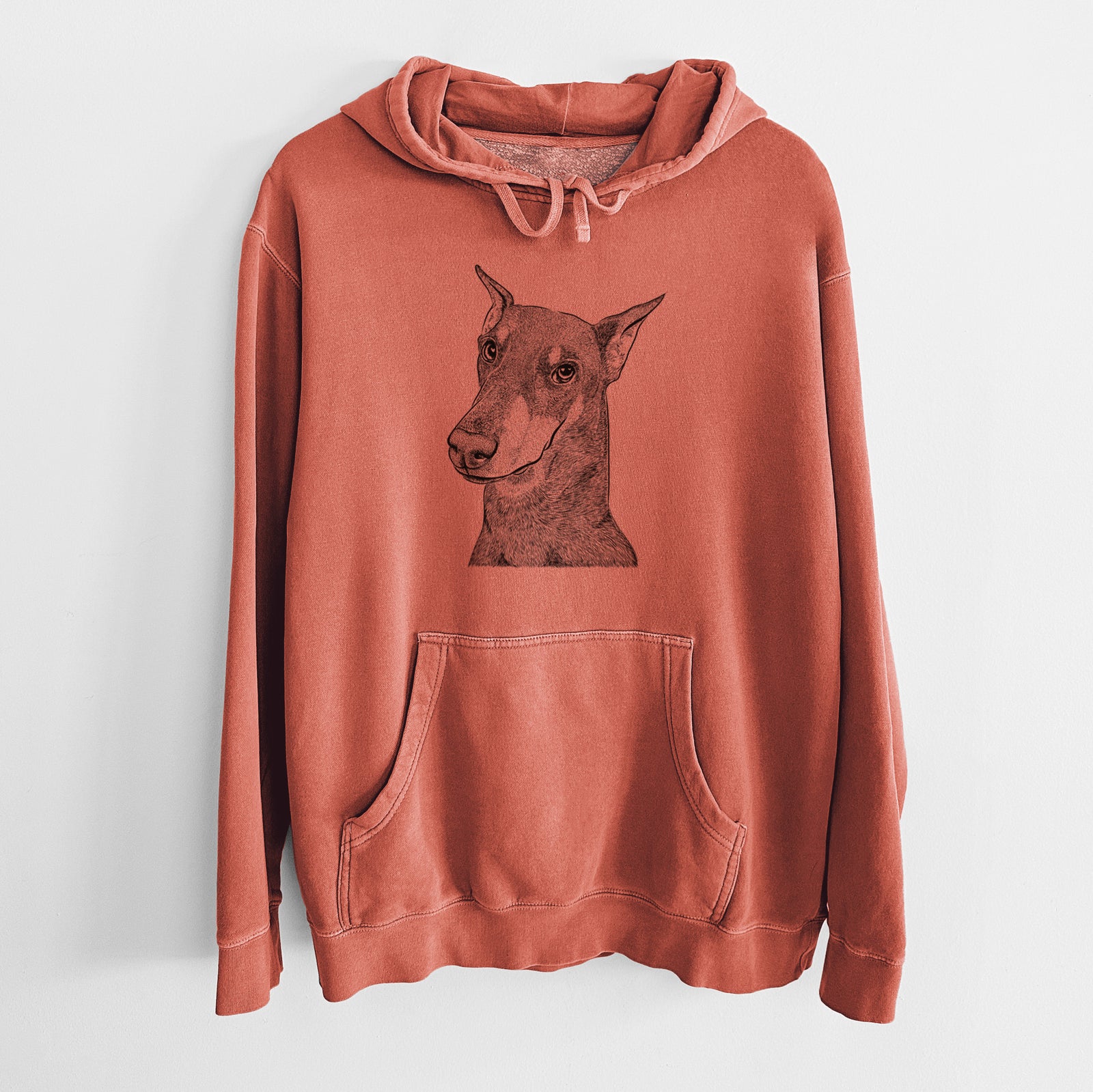 Hand-drawn sketch of Shelby the Doberman Pinscher on an Amber Unisex pigment dyed hoodie