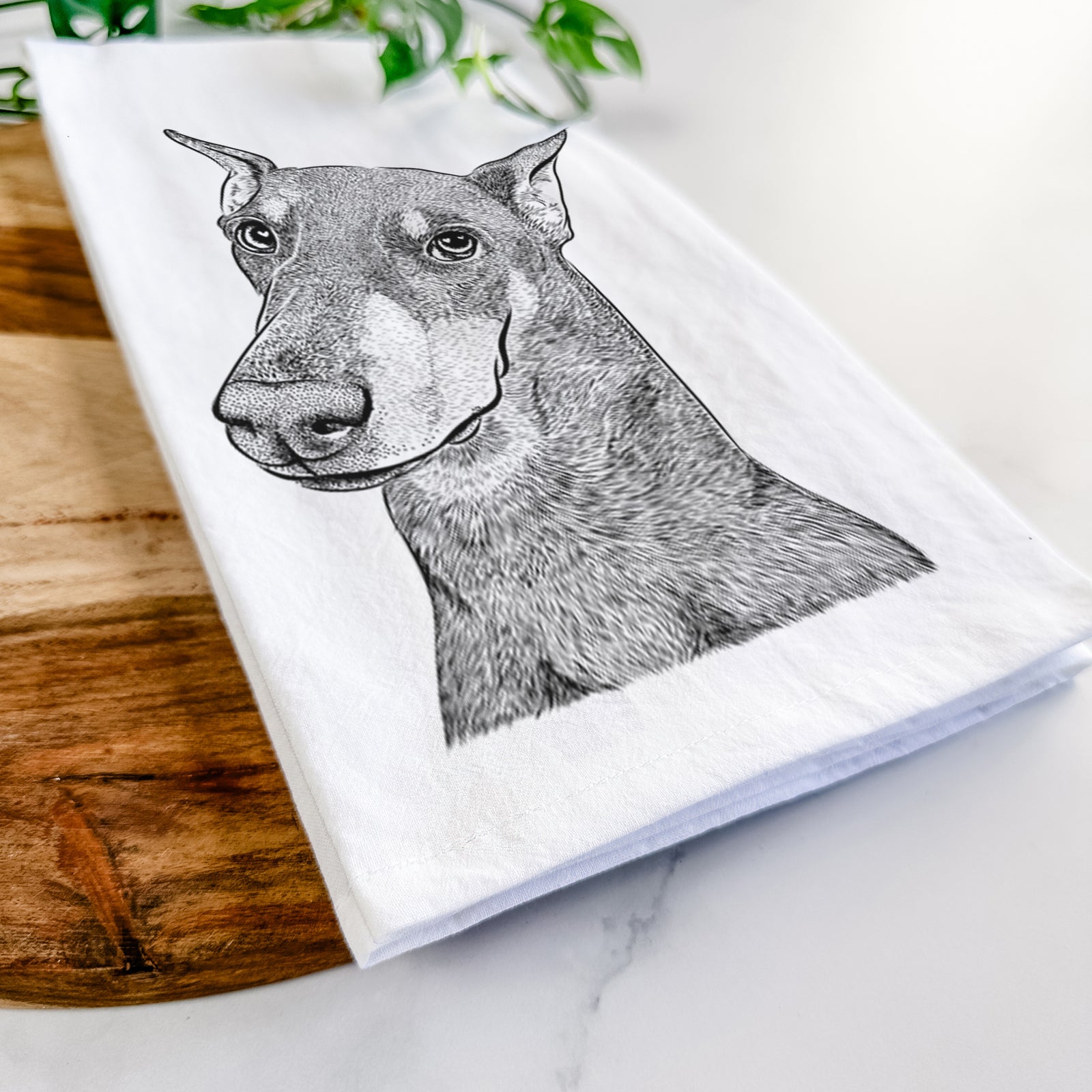 Hand-drawn sketch of Shelby the Doberman Pinscher on a tea towel