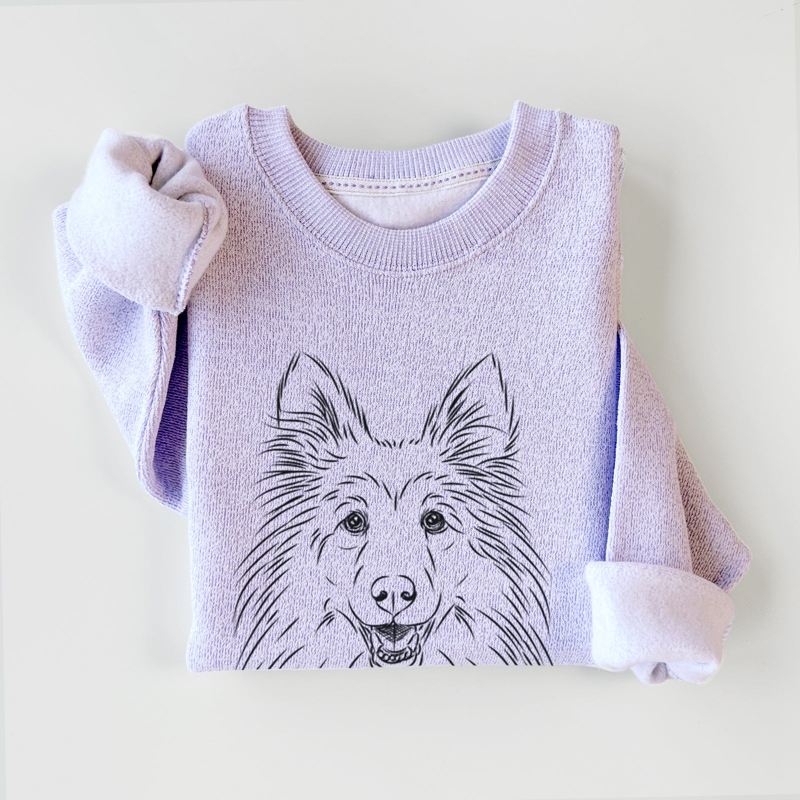 Hand-drawn sketch of Sheldon the Shetland Sheepdog on an Ice Purple knit sweatshirt