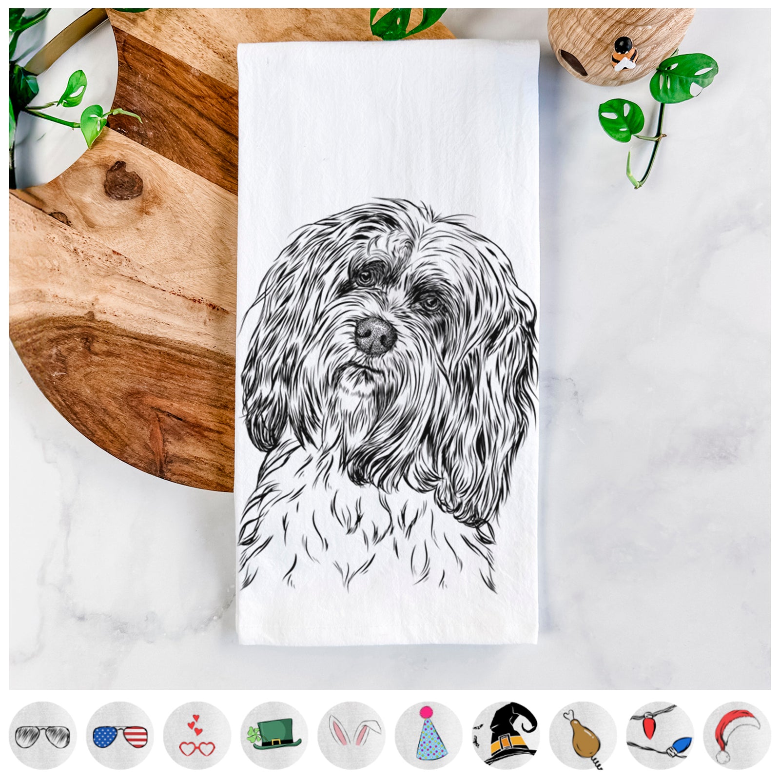 Hand-drawn sketch of Shenpa the Tibetan Terrier on a tea towel, shown with icons of the other available costume styles