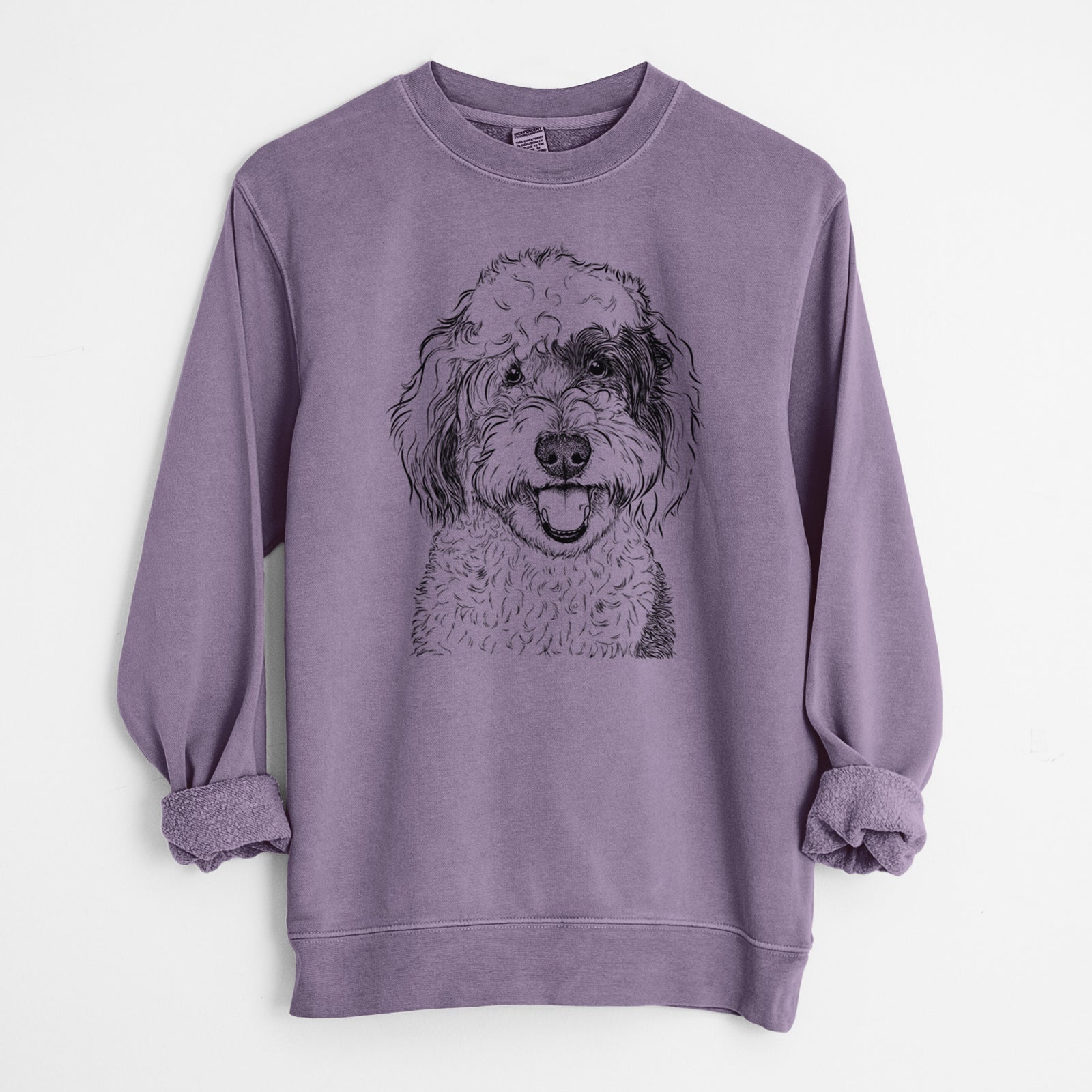 Hand-drawn sketch of Sherlock the Sheepadoodle on a Plum Unisex pigment dyed crew sweatshirt