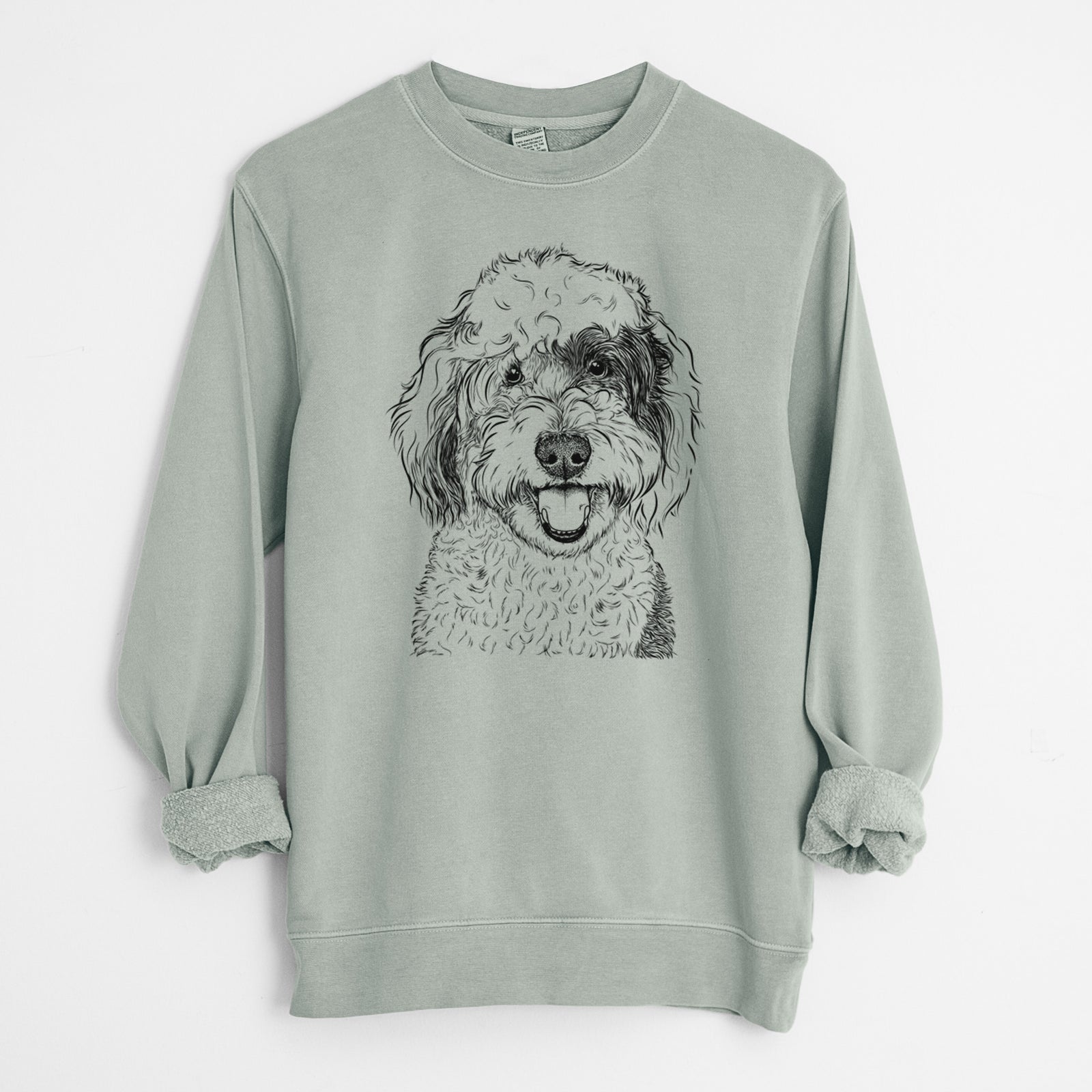 Hand-drawn sketch of Sherlock the Sheepadoodle on a Sage Unisex pigment dyed crew sweatshirt