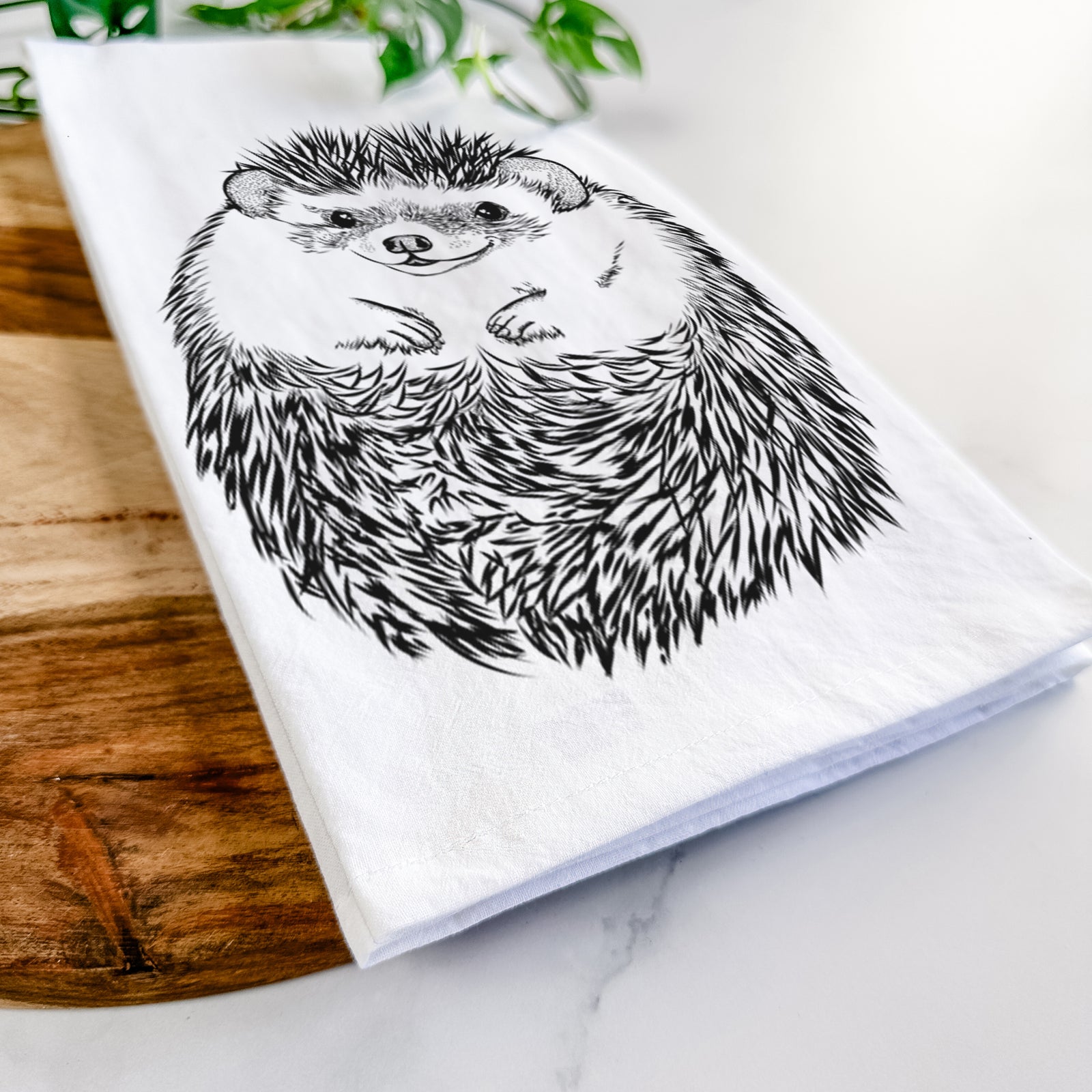 Hand-drawn sketch of Sid the Hedgehog on a tea towel
