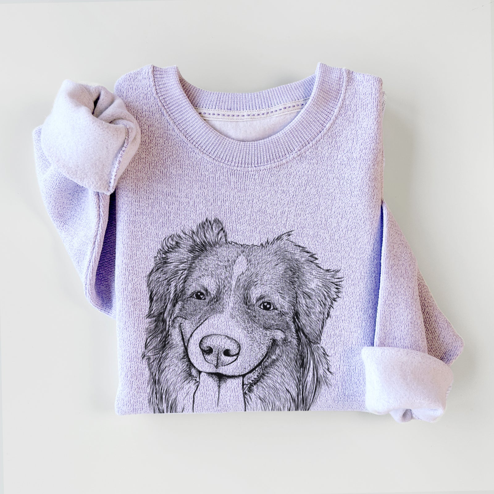 Hand-drawn sketch of Siena the Australian Shepherd on an Ice Purple knit sweatshirt