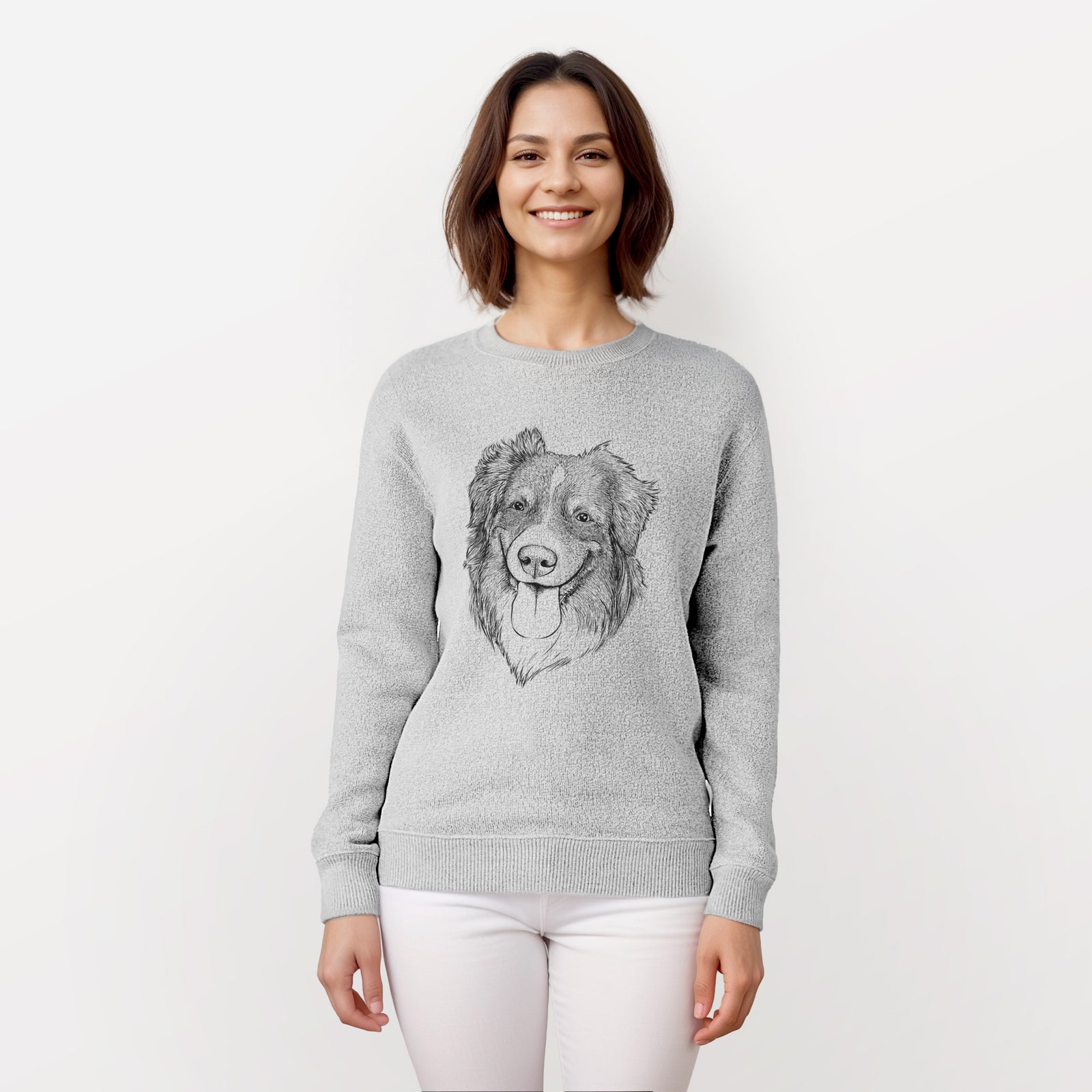 Hand-drawn sketch of Siena the Australian Shepherd on a knit sweatshirt, worn by a woman