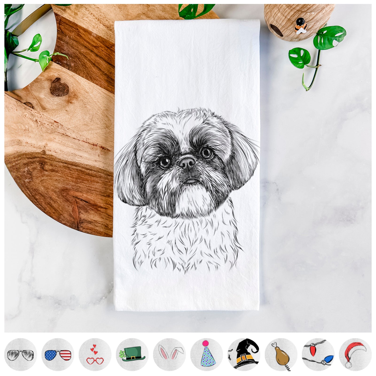 Hand-drawn sketch of Simon the Shih Tzu on a tea towel, shown with icons of the other available costume styles