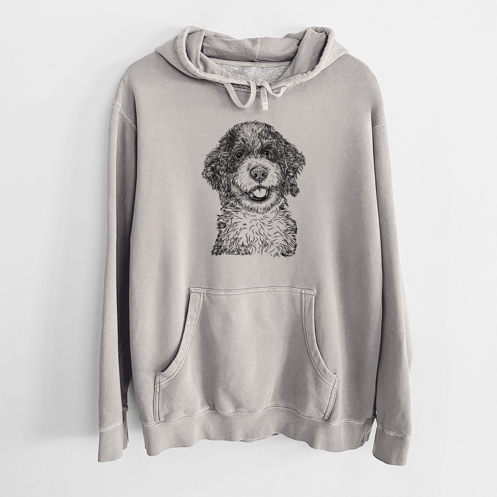 Hand-drawn sketch of Smoky the Bernedoodle Puppy on a Cement Unisex pigment dyed hoodie
