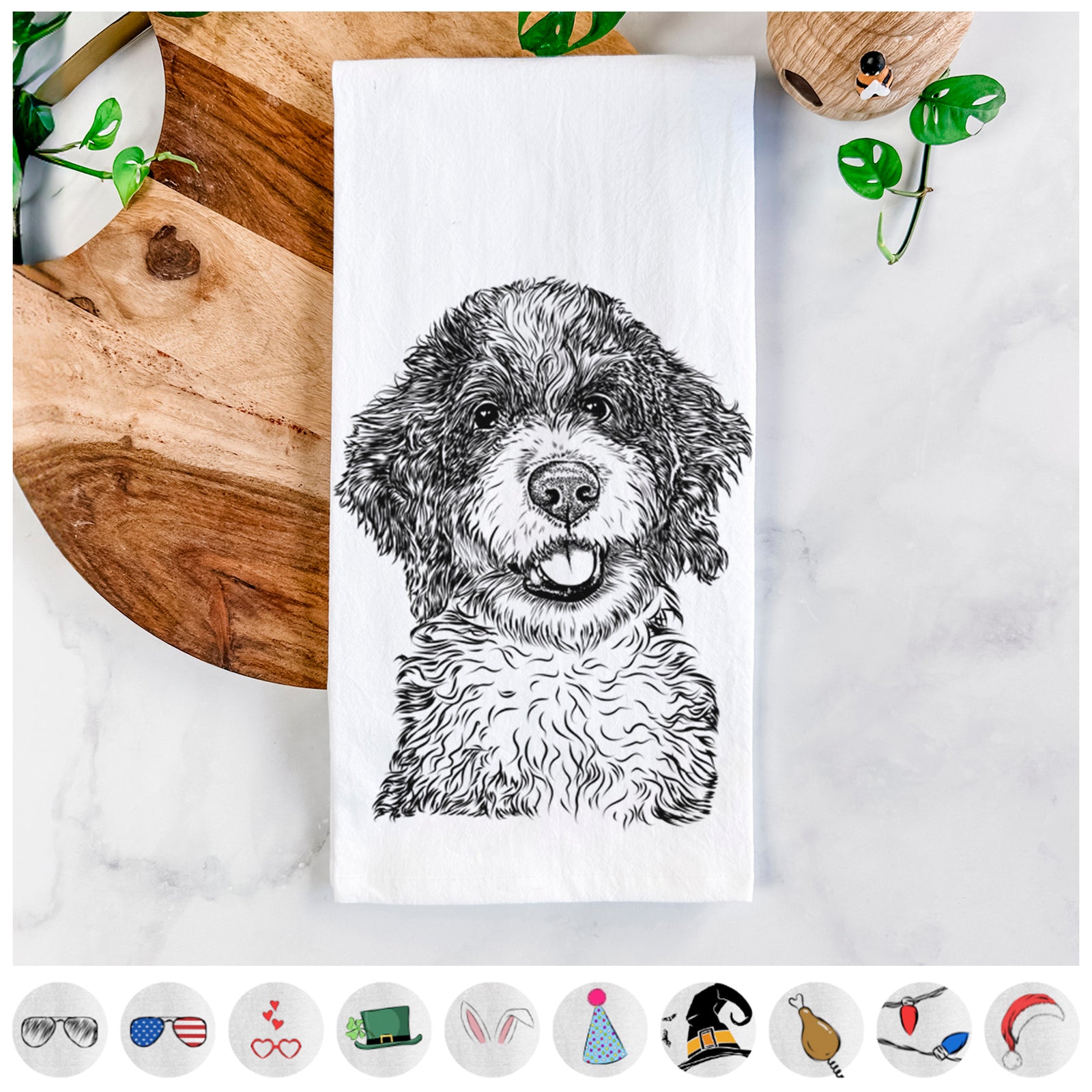 Hand-drawn sketch of Smoky the Bernedoodle Puppy on a tea towel, shown with icons of the other available costume styles