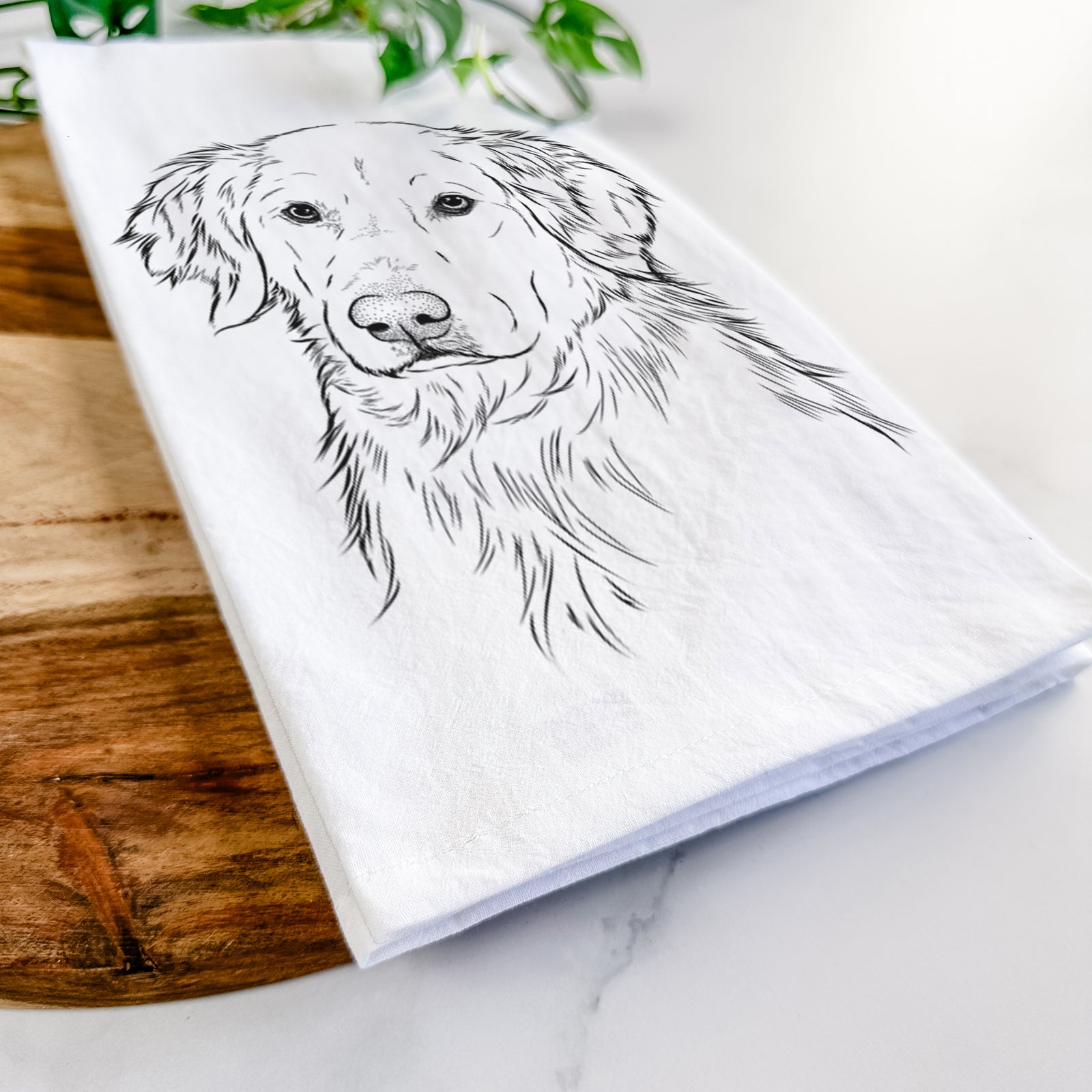 Hand-drawn sketch of Spencer the Golden Retriever on a tea towel