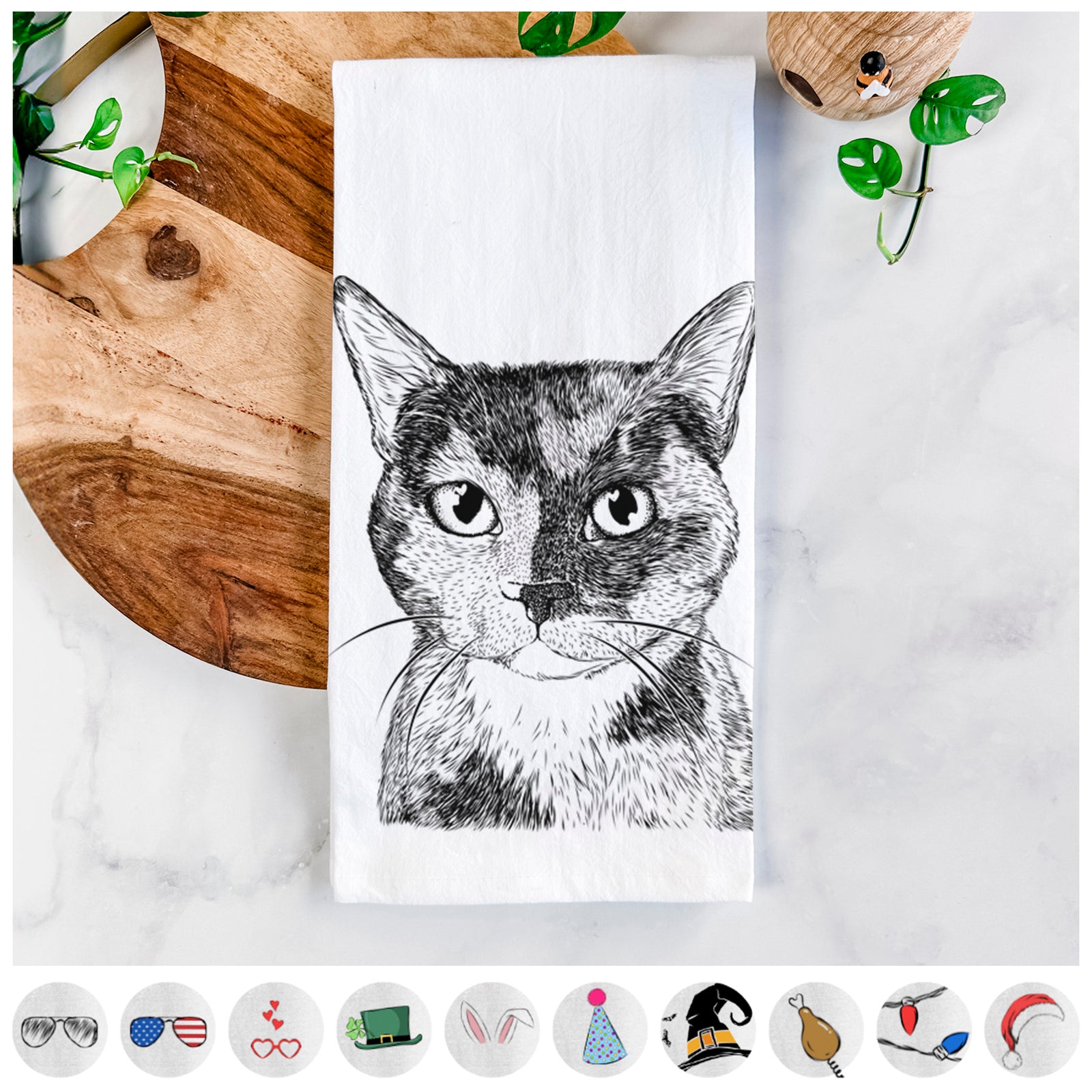 Hand-drawn sketch of Spooky Kitty the Tortoiseshell Cat on a tea towel, shown with icons of the other available costume styles