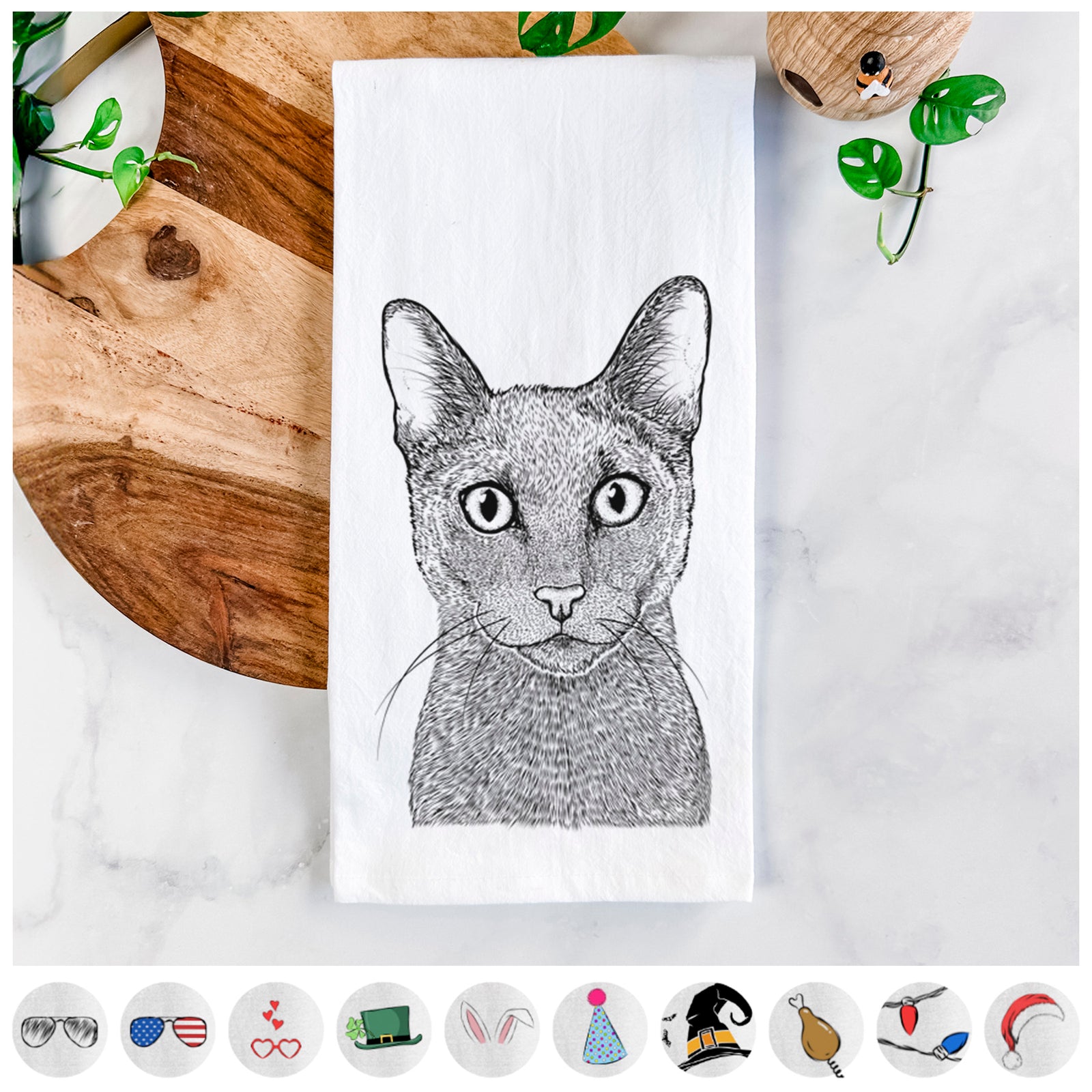 Hand-drawn sketch of Stanley the Russian Blue Cat on a tea towel, shown with icons of the other available costume styles